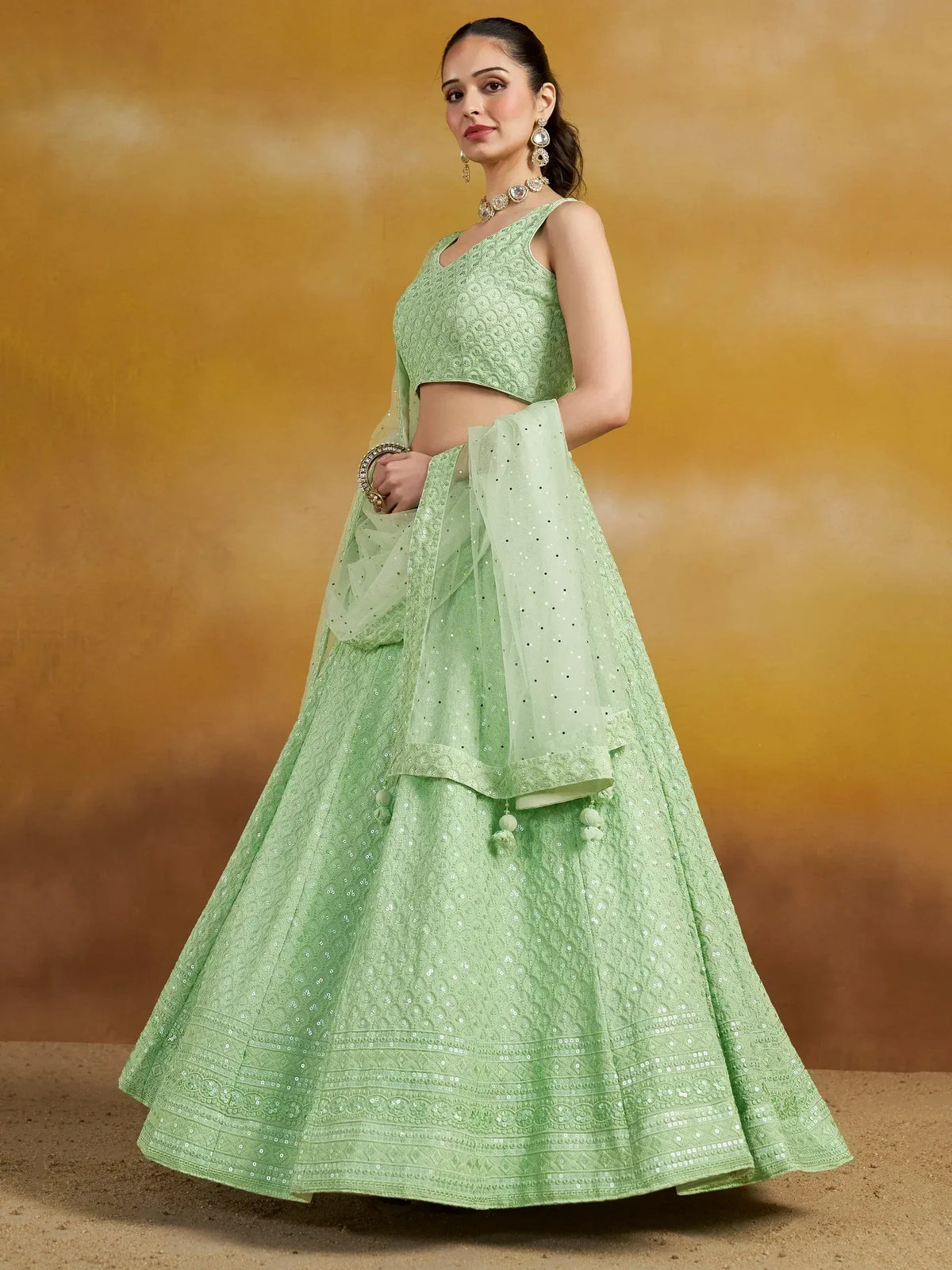 Mint green designer lehenga choli with sequin embroidery and matching dupatta for Indian ethnic wear