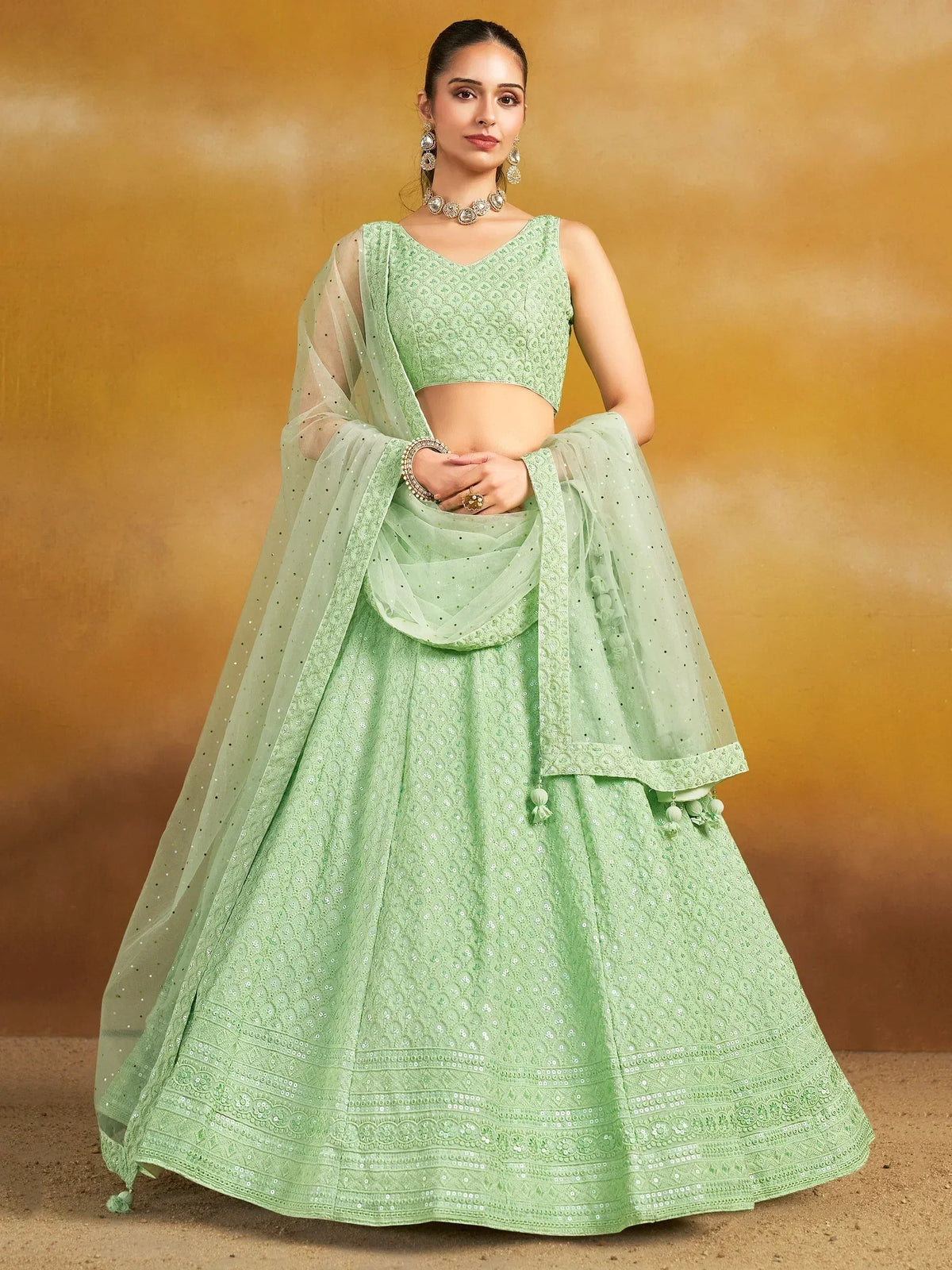 Mint green embroidered lehenga choli with sheer dupatta, perfect for Indian ethnic occasions