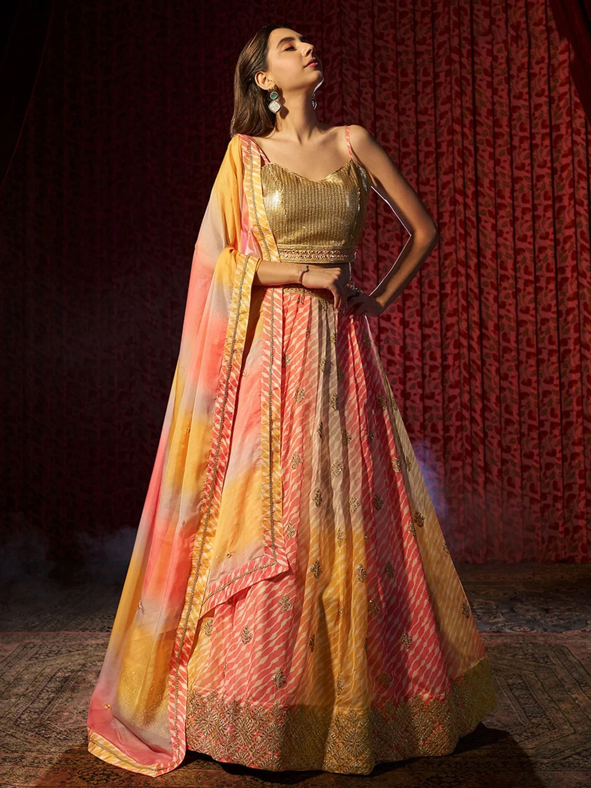 Gold sequin crop top with peach and yellow ombre lehenga choli, perfect for Indian ethnic wear events