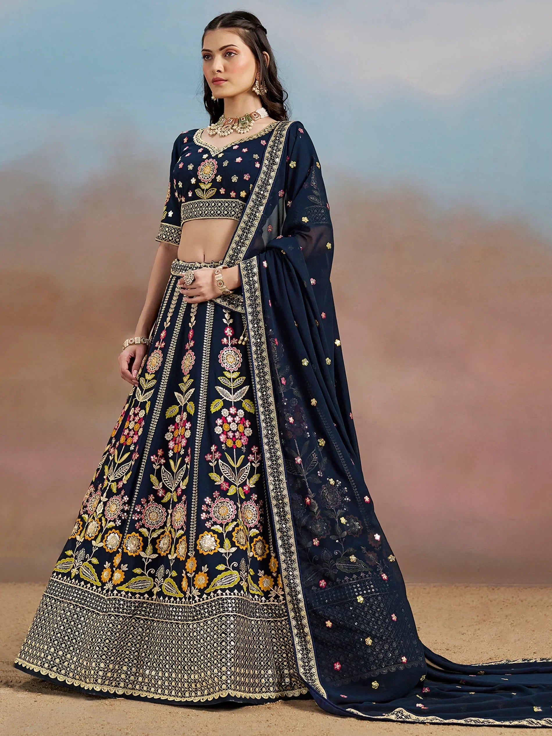 Navy blue embroidered lehenga choli with floral motifs and dupatta, perfect for Indian ethnic occasions