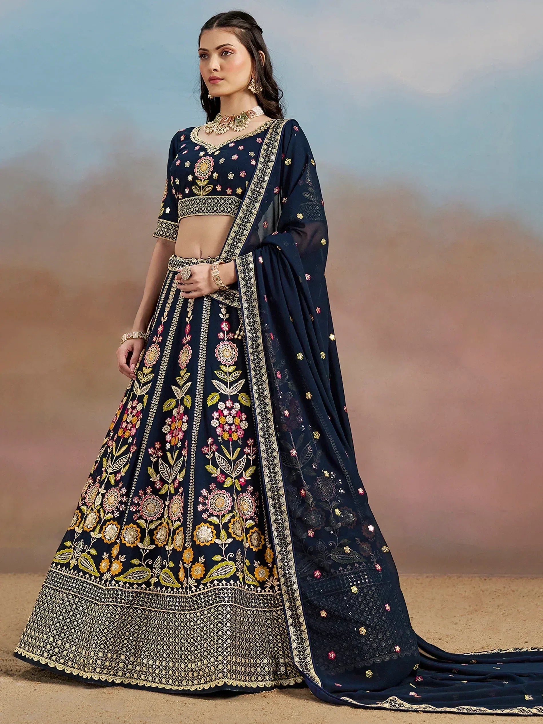 Navy blue embroidered lehenga choli with floral motifs and dupatta, perfect for Indian ethnic occasions