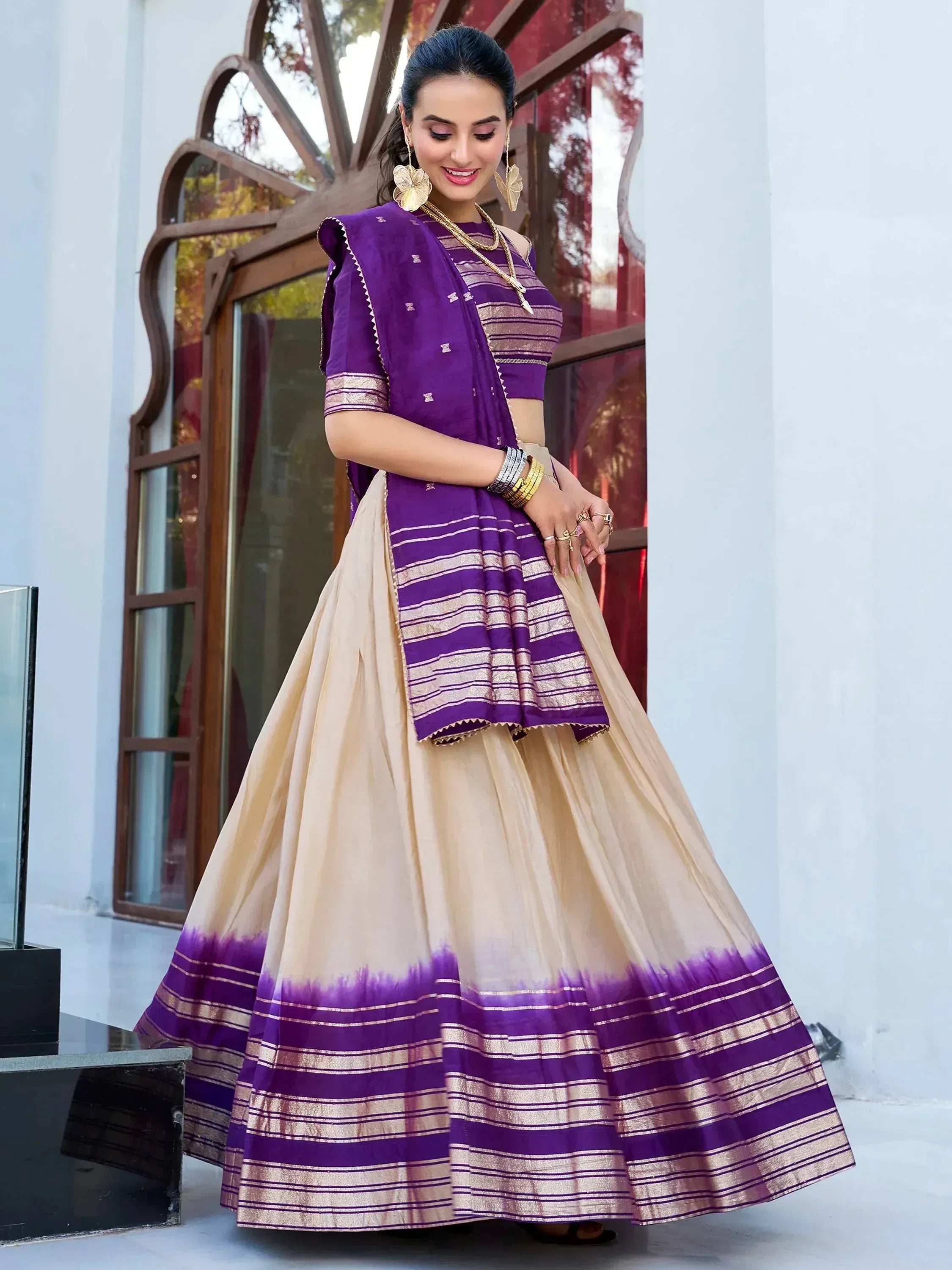 Purple and beige lehenga choli with striped border, perfect for Indian ethnic wear occasions