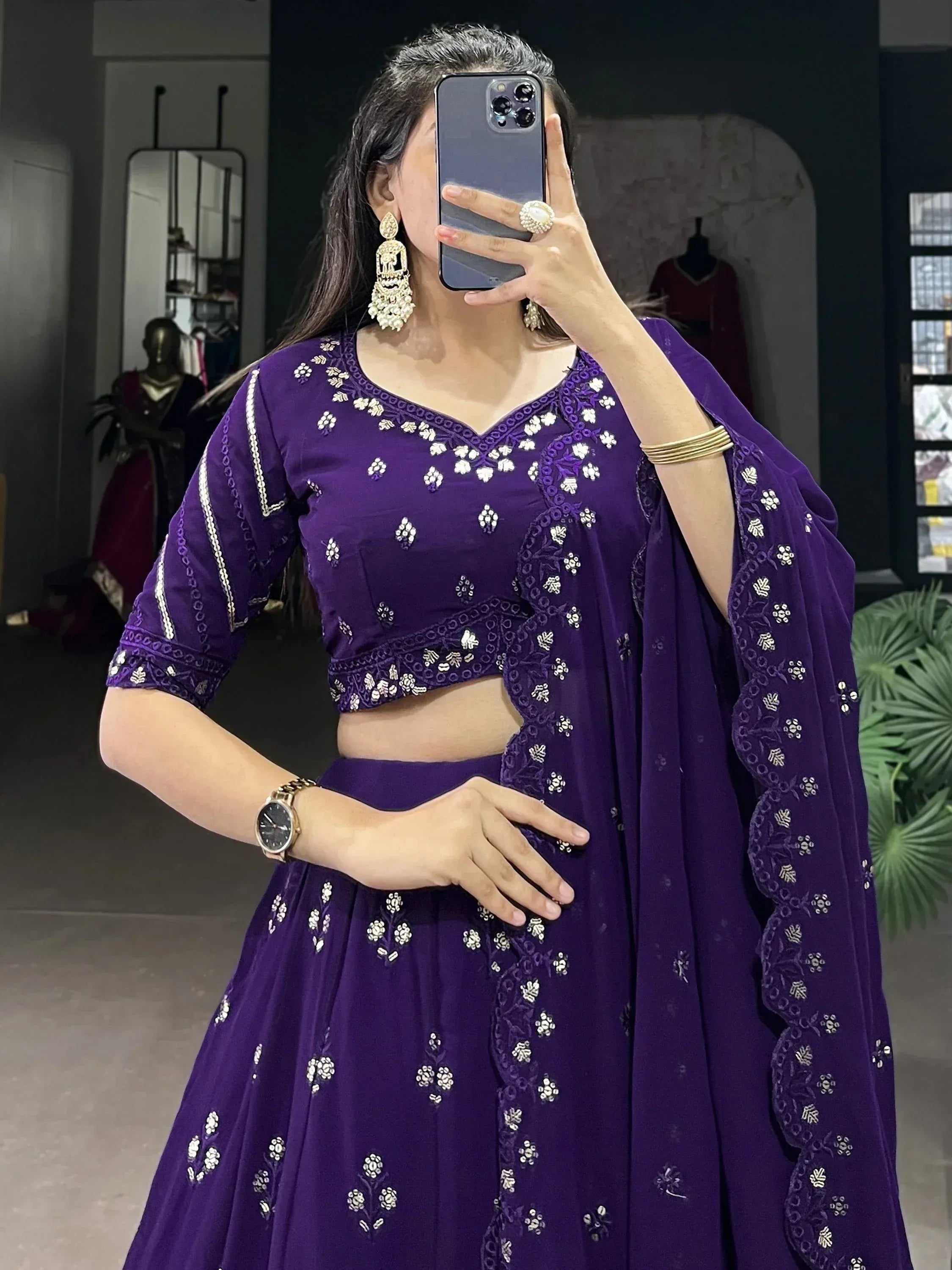 Purple embroidered lehenga choli with floral motifs, perfect for Indian ethnic wear occasions.