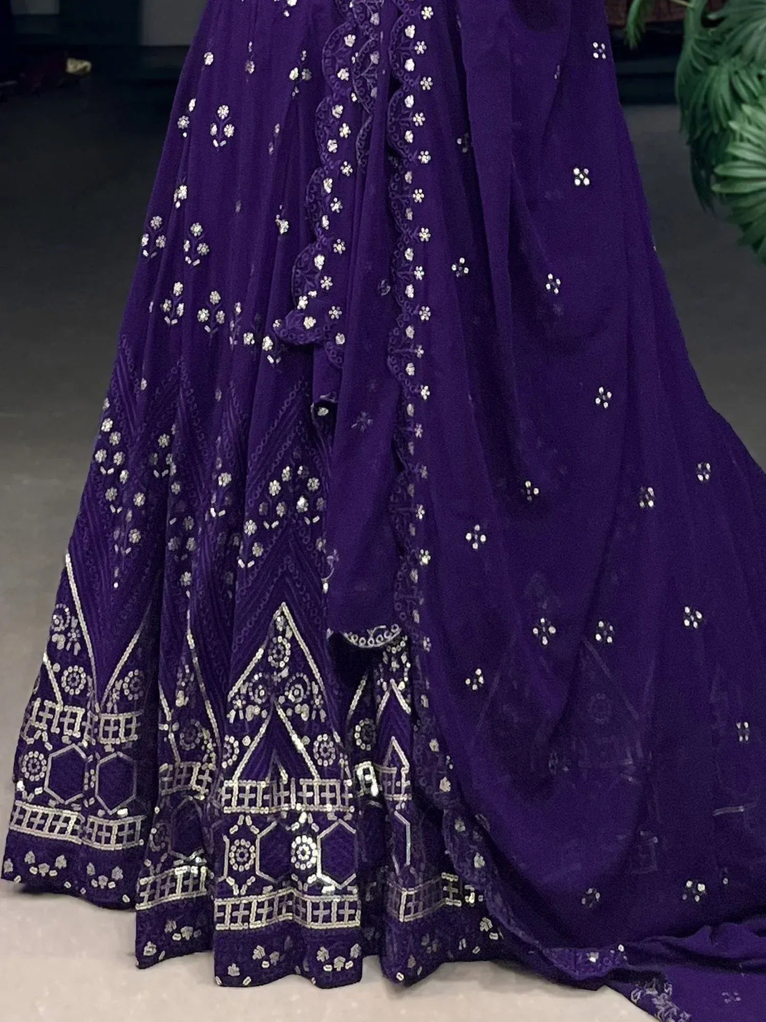 Purple ethnic lehenga with silver mirror work and geometric embroidery, perfect for Indian weddings and festivals