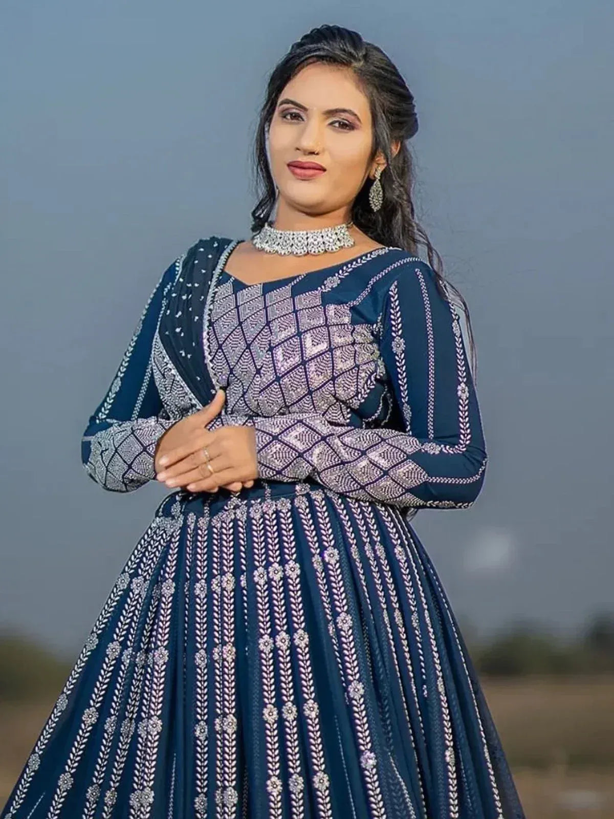 Blue embroidered ethnic gown with geometric patterns, perfect for Indian occasions and festive wear.