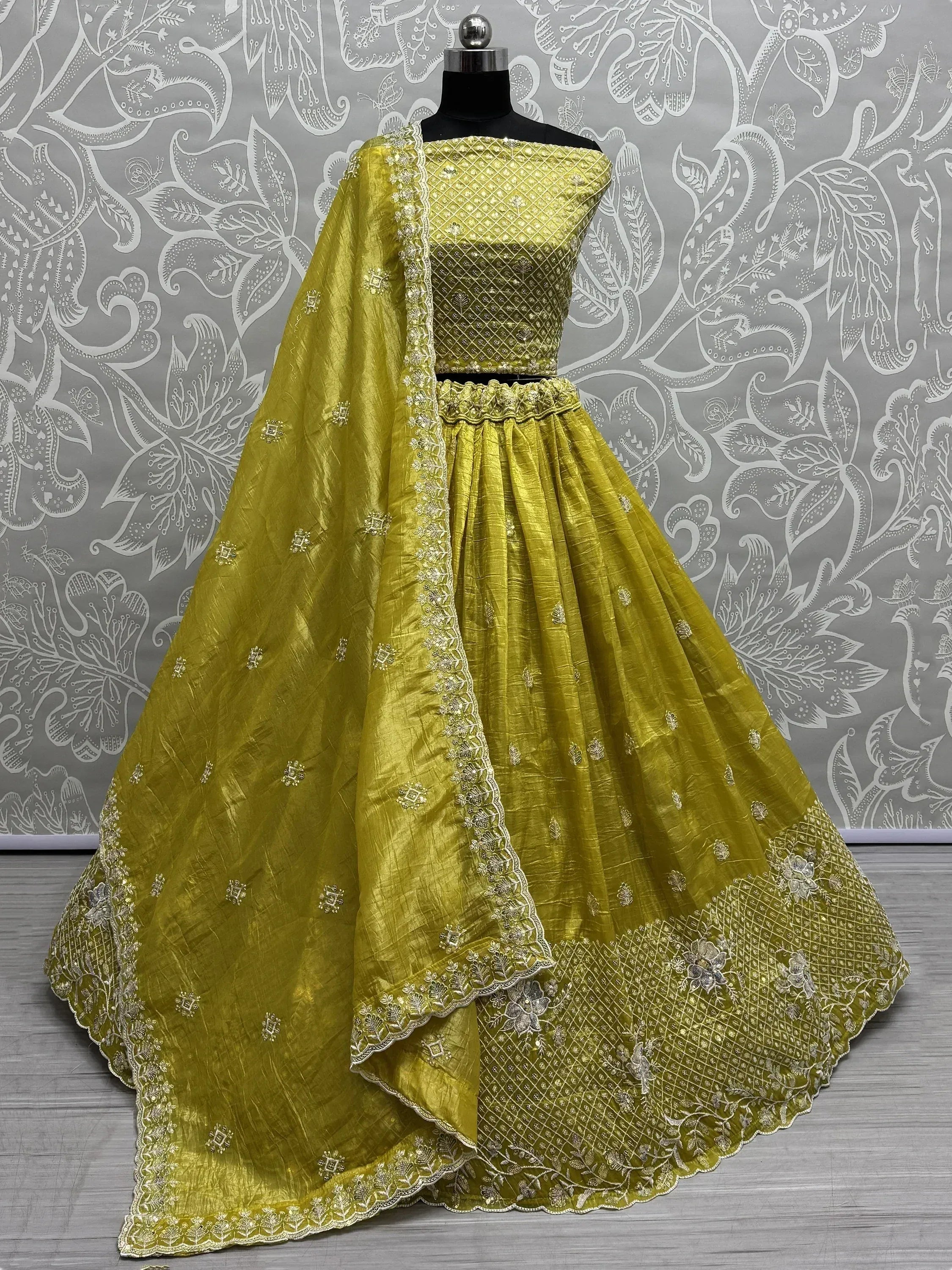 Mustard yellow designer lehenga choli with gold embroidery and scalloped dupatta, perfect for weddings and festivals