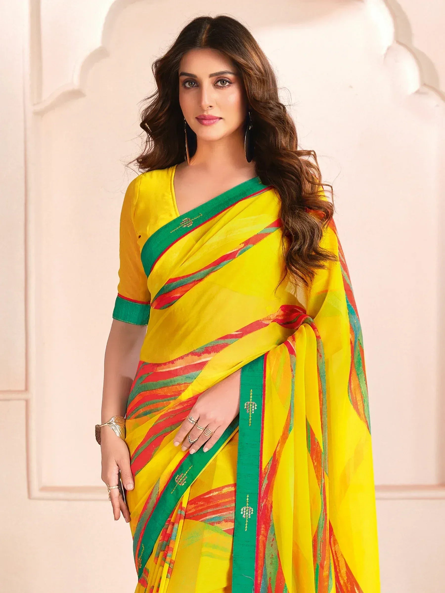 Vibrant yellow saree with green and red stripes, perfect for Indian ethnic wear occasions