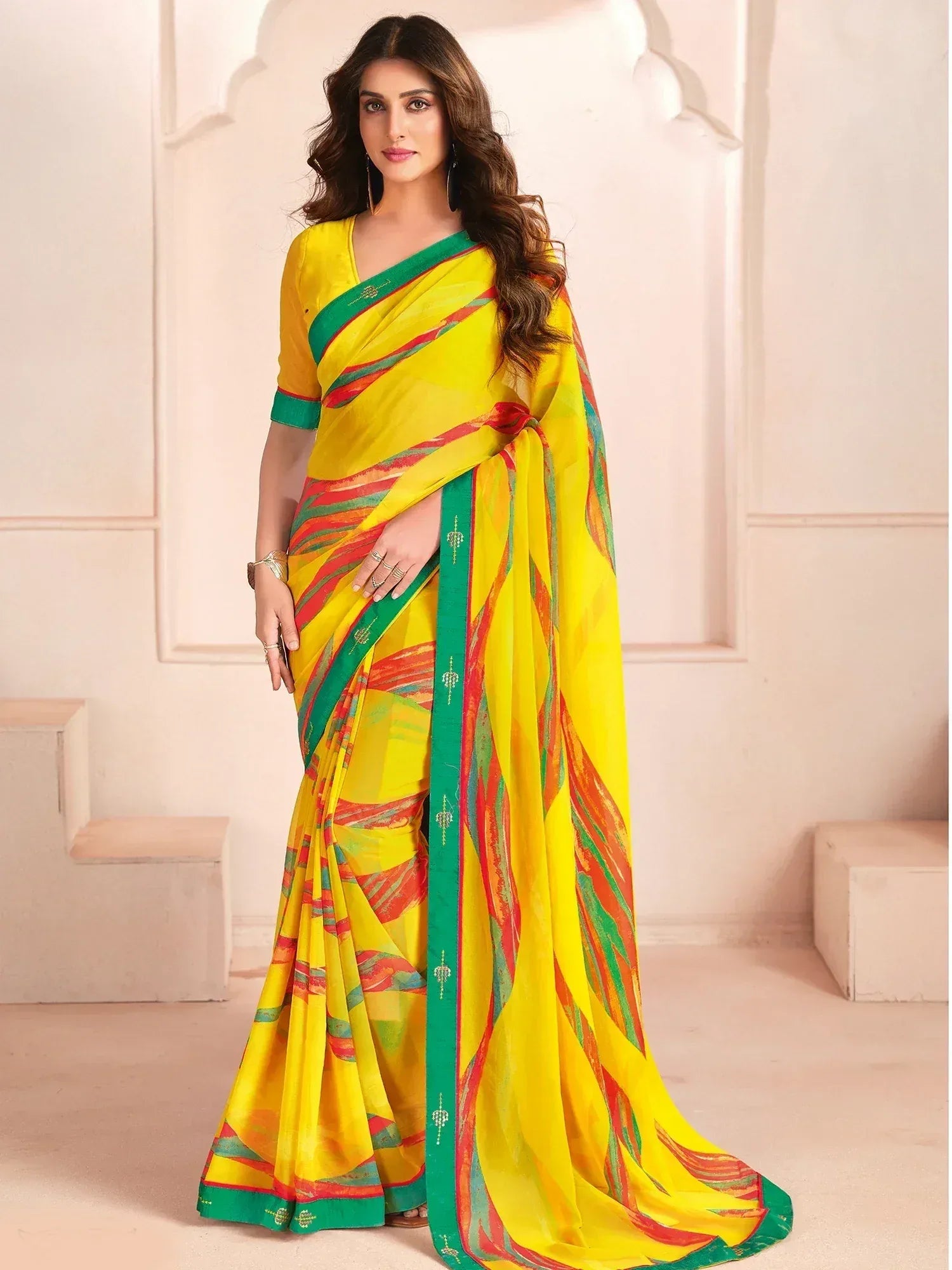 Vibrant yellow saree with green border and red stripes, stylish Indian ethnic wear for women