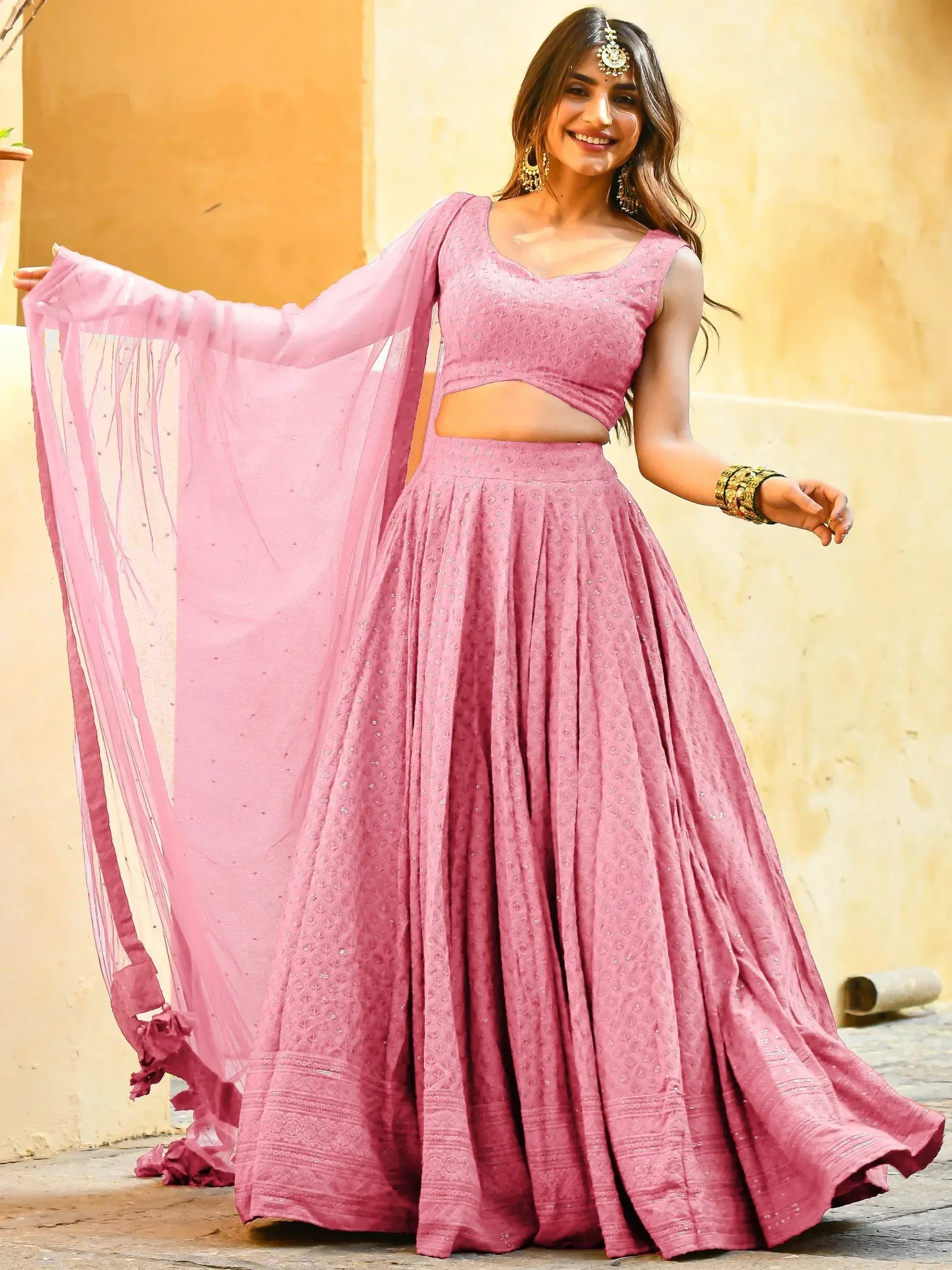 Pink embroidered lehenga choli with sheer dupatta, perfect for Indian ethnic wear and festive occasions