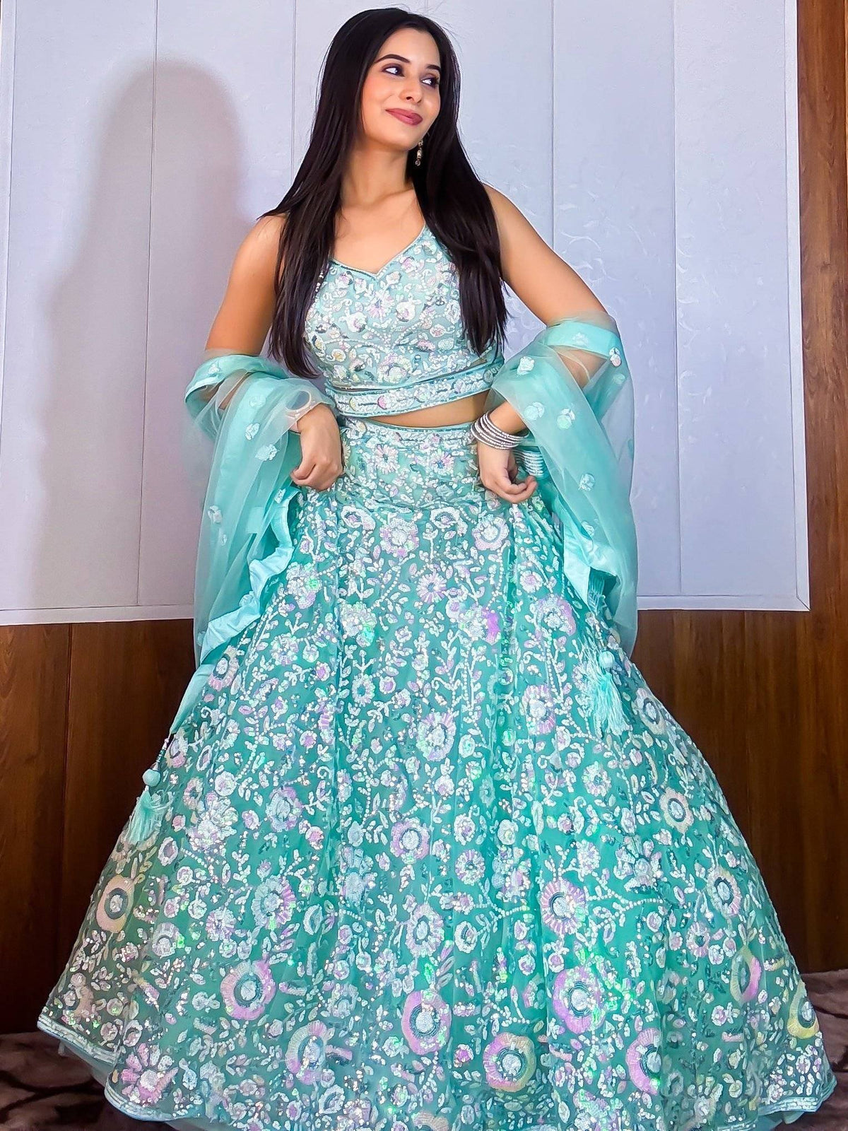 Mint green embroidered lehenga choli with floral sequin work, perfect for Indian ethnic wear events.