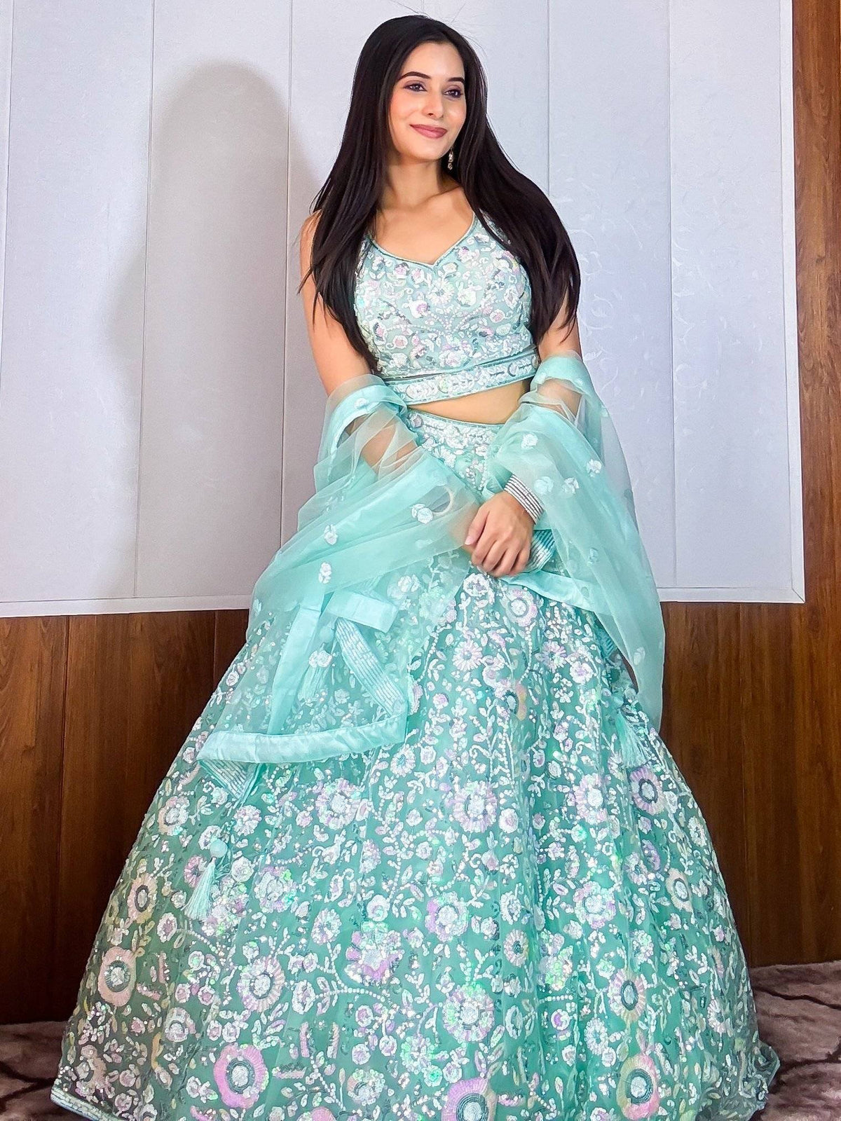 Mint green floral embroidered lehenga choli with sheer dupatta, perfect for Indian ethnic occasions