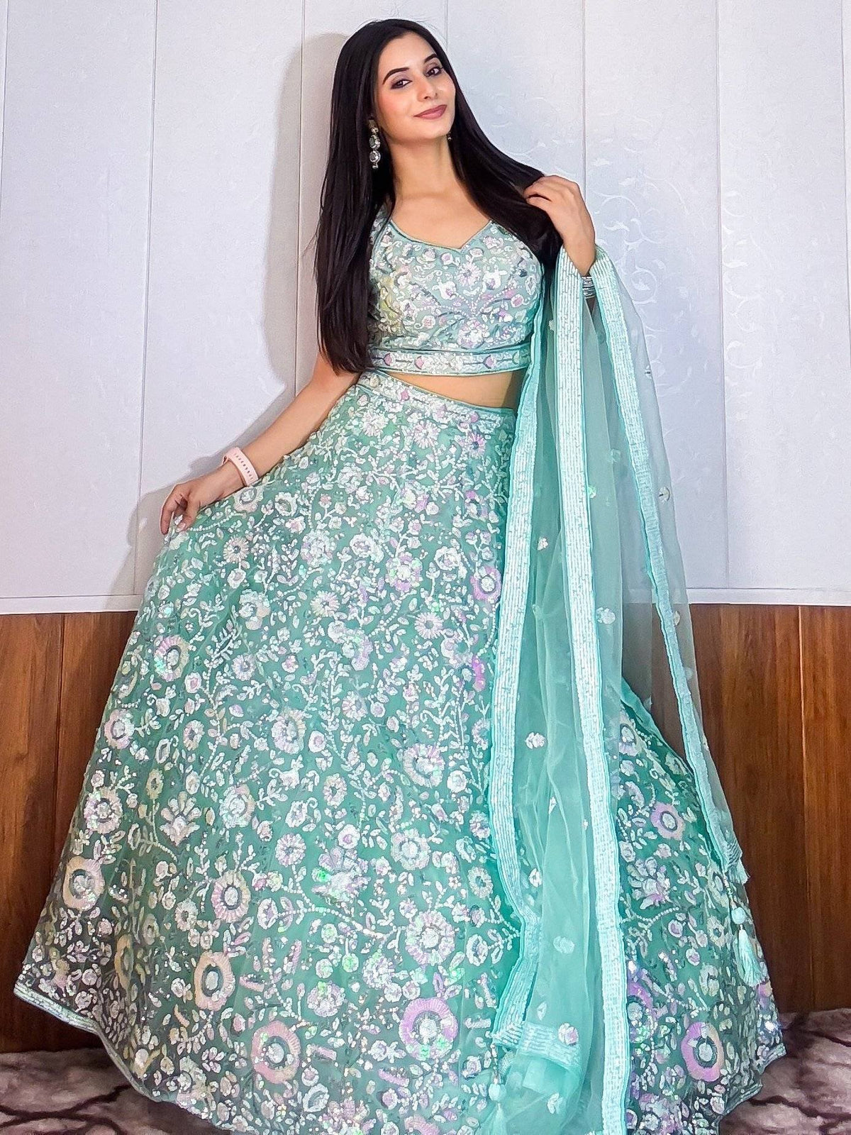 Mint green floral embroidered lehenga choli with matching dupatta, perfect for Indian ethnic occasions.