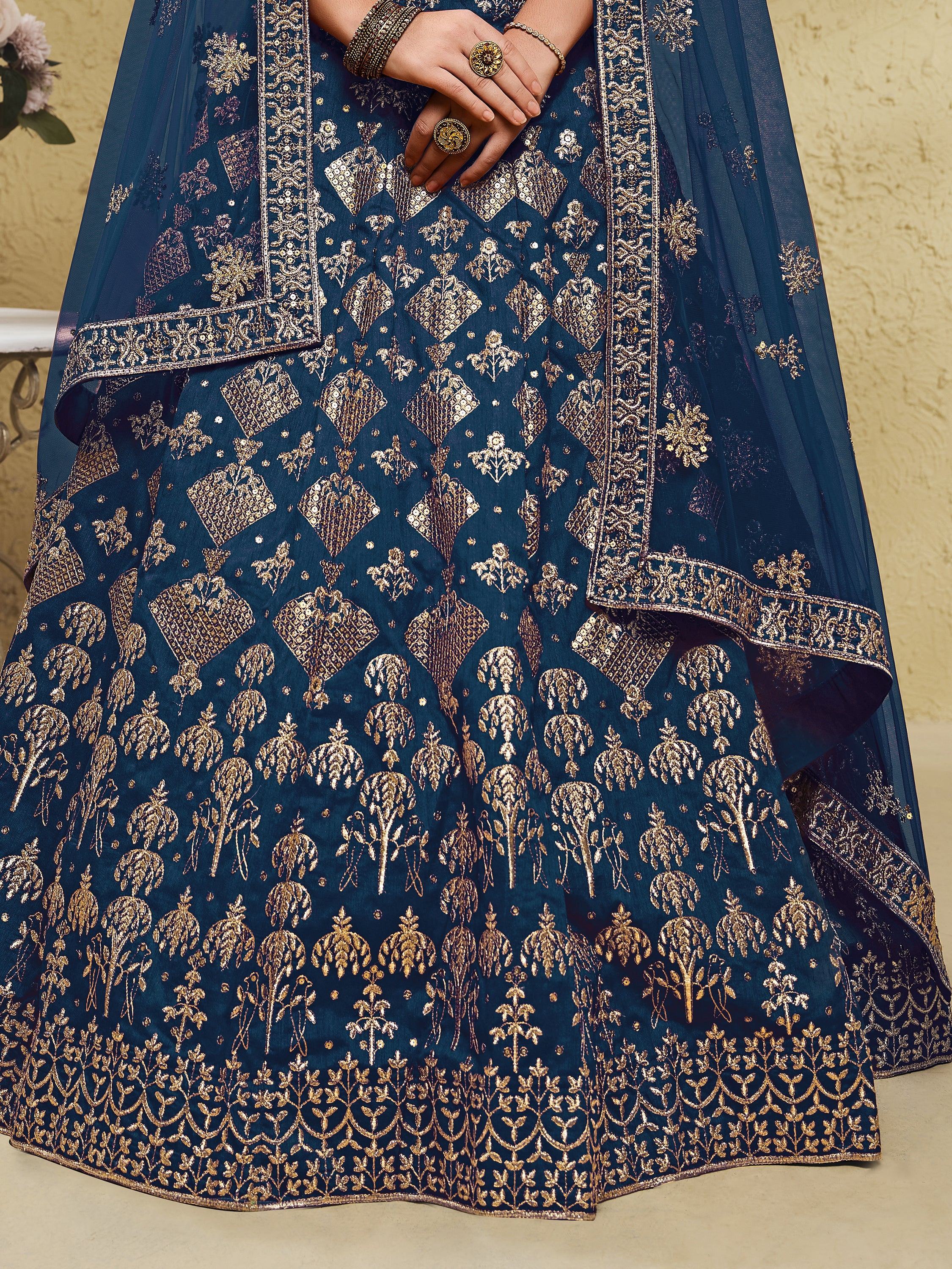 Elegant navy blue lehenga choli with gold floral embroidery and sequin detailing, perfect for Indian ethnic wear.