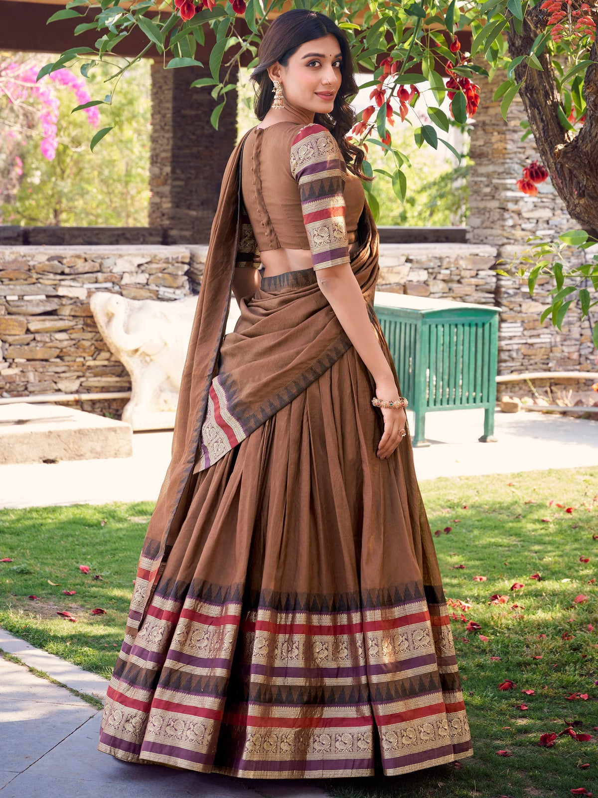 Brown designer lehenga choli with embroidered border, perfect for Indian ethnic wear occasions.