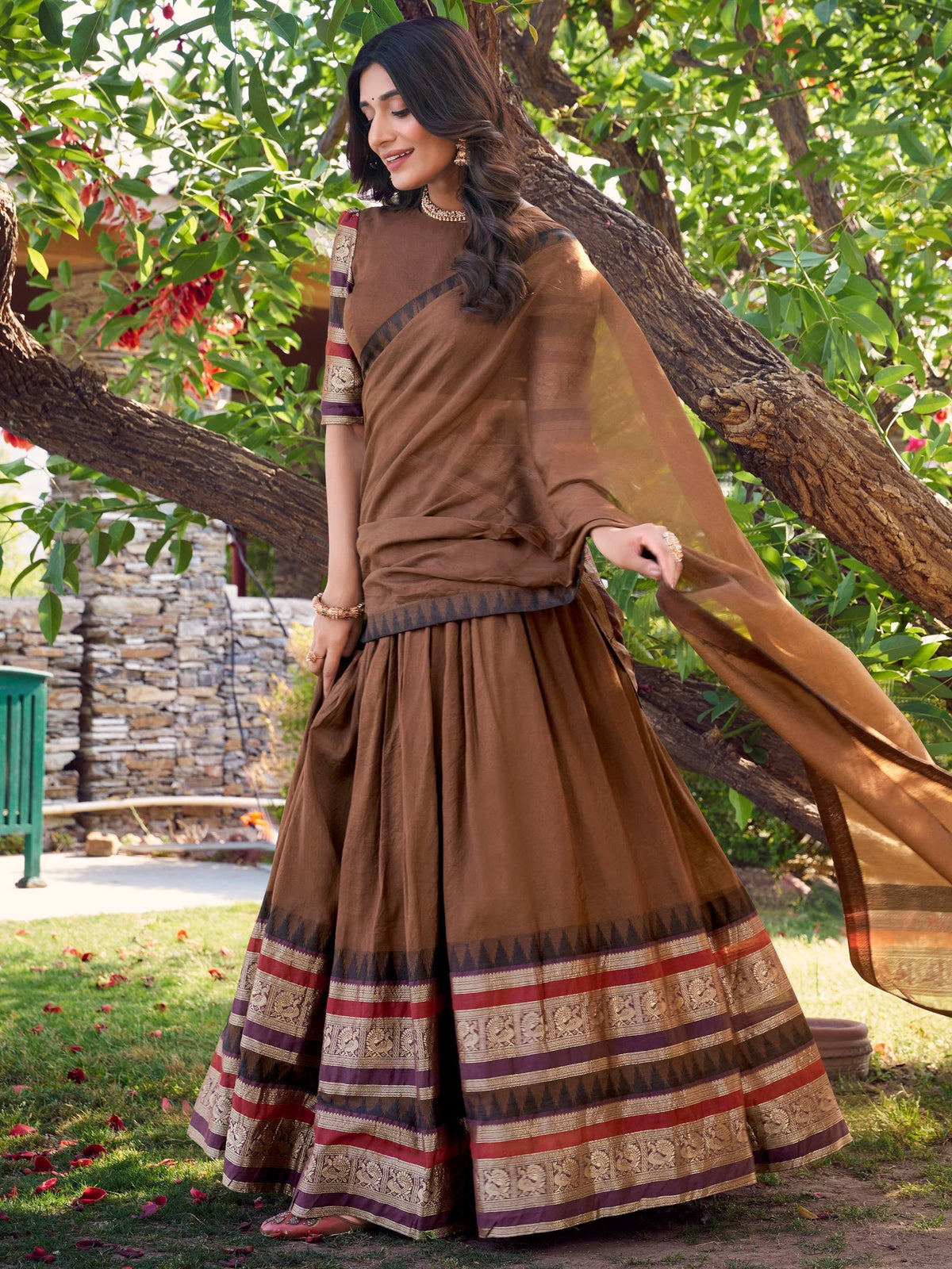 Brown ethnic saree with woven border, styled as a lehenga choli, perfect for Indian occasions