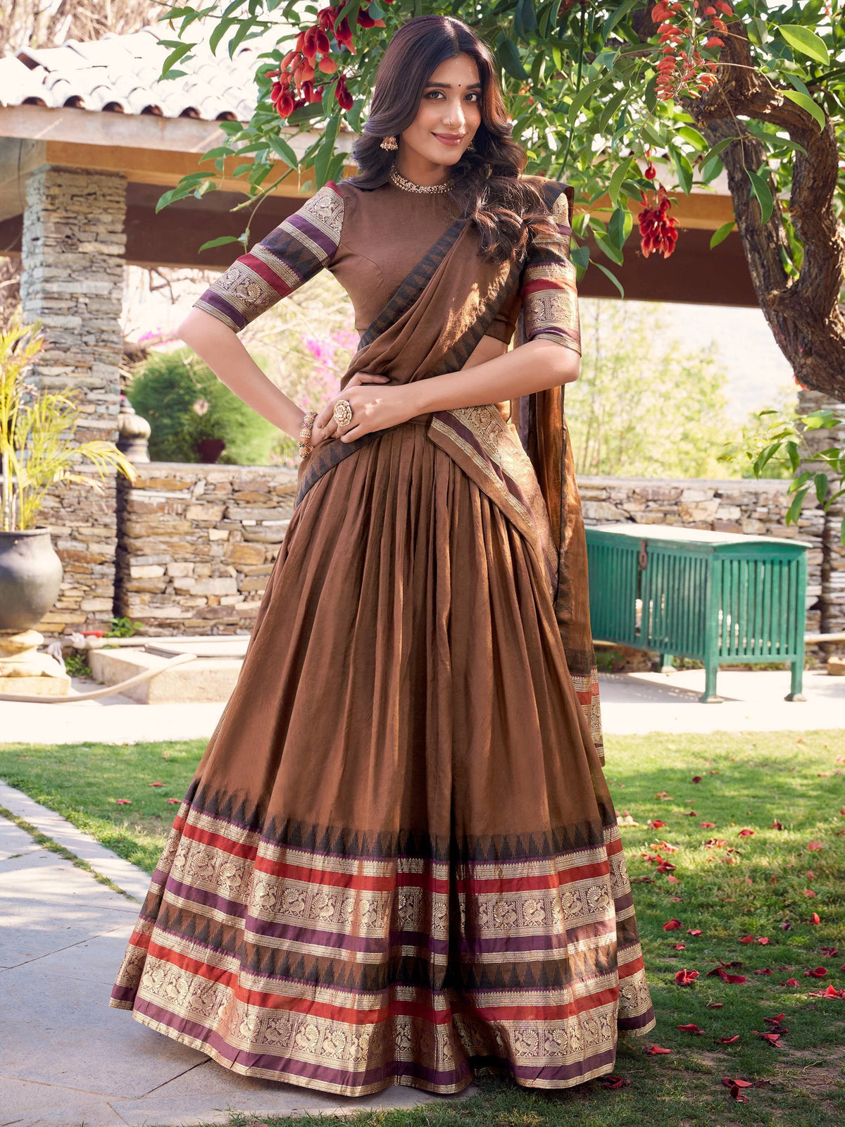Brown ethnic lehenga choli with gold and red border, perfect for Indian weddings and festive occasions