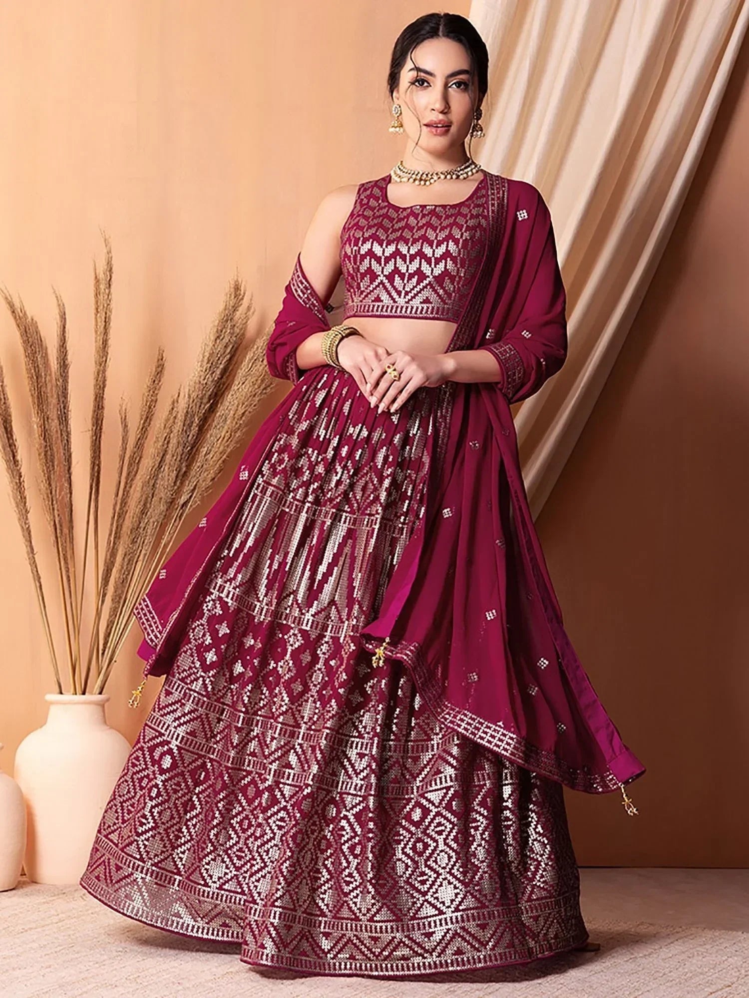 Burgundy embroidered lehenga choli with geometric patterns, perfect for Indian ethnic wear occasions