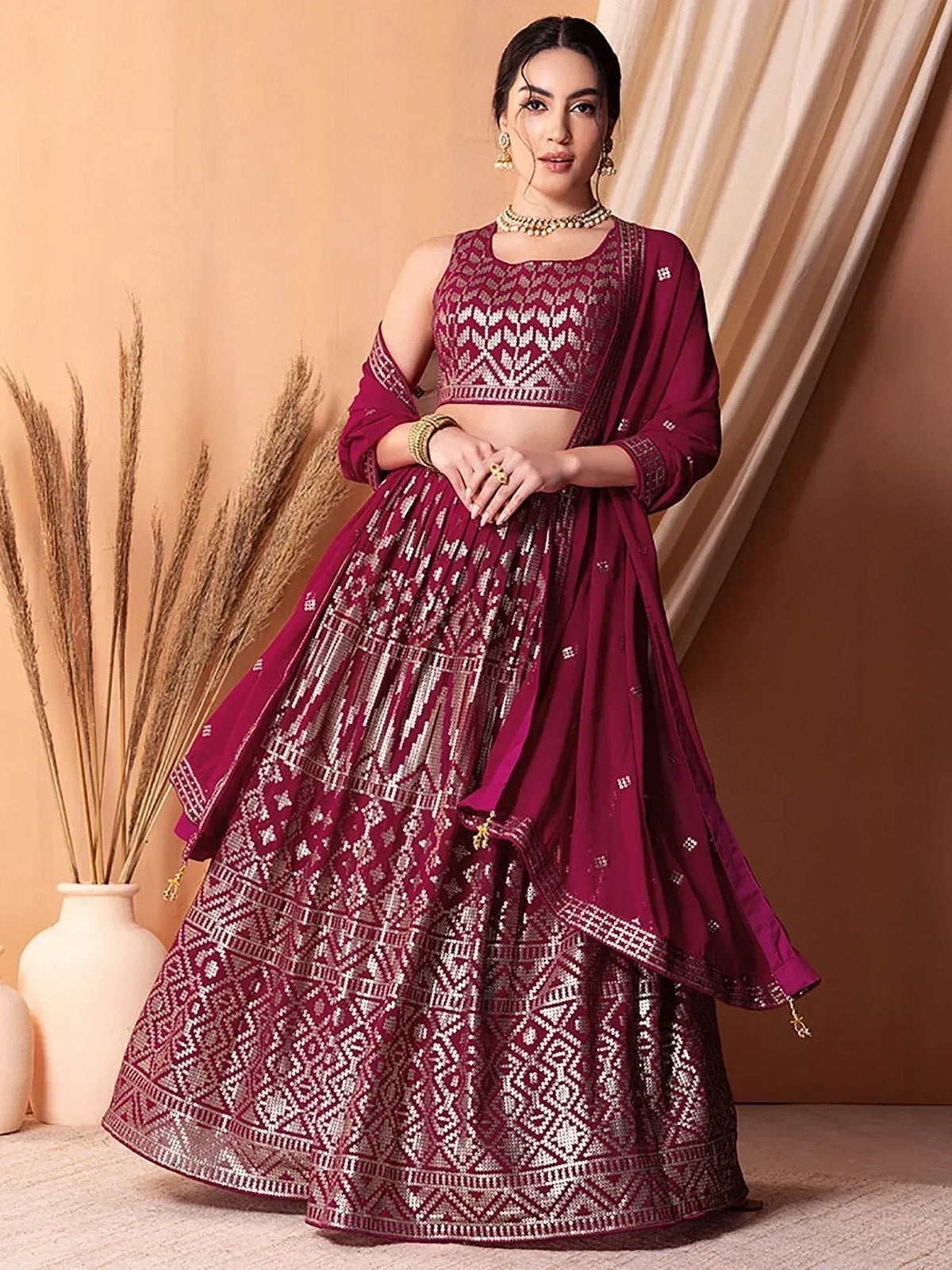 Burgundy embroidered lehenga choli with geometric patterns, perfect for Indian ethnic wear occasions