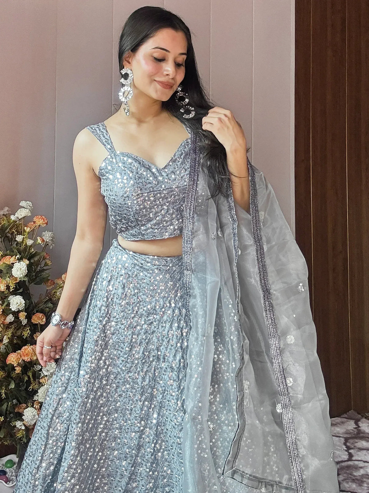 Elegant grey lehenga choli with floral sequin work and sheer dupatta, perfect for Indian ethnic occasions.