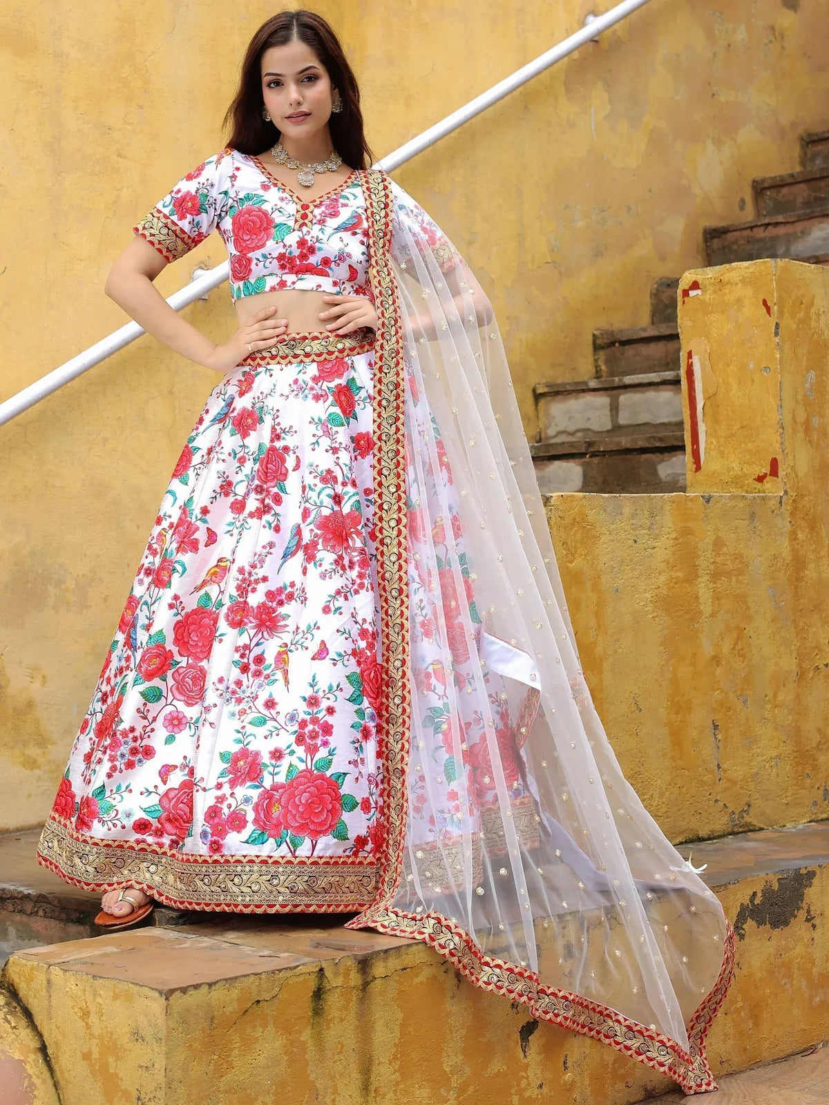 White floral lehenga choli with gold border, perfect for Indian ethnic wear and festive occasions