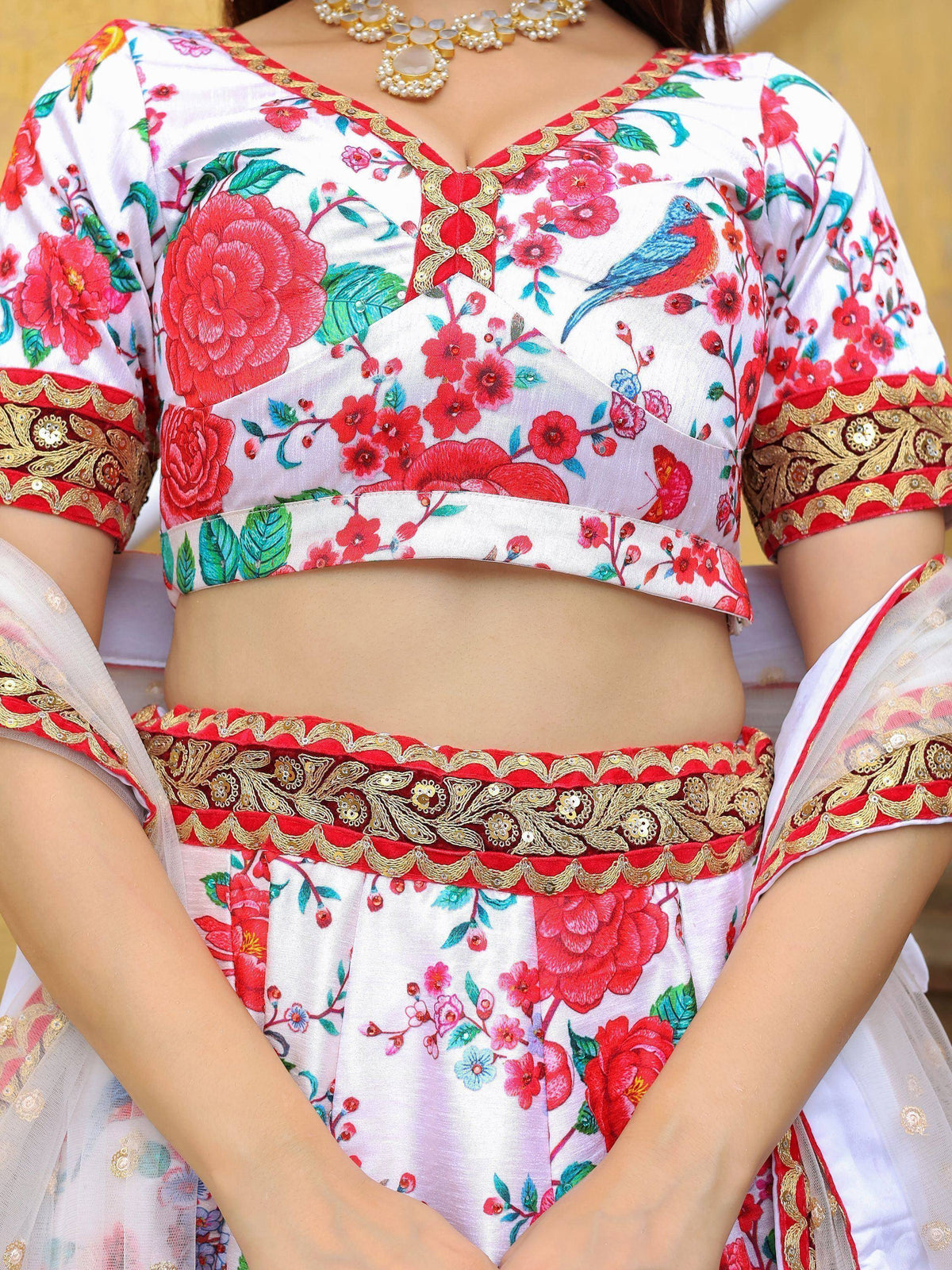 White floral lehenga choli with red gold embroidery, bird print, and designer neckline for Indian ethnic wear