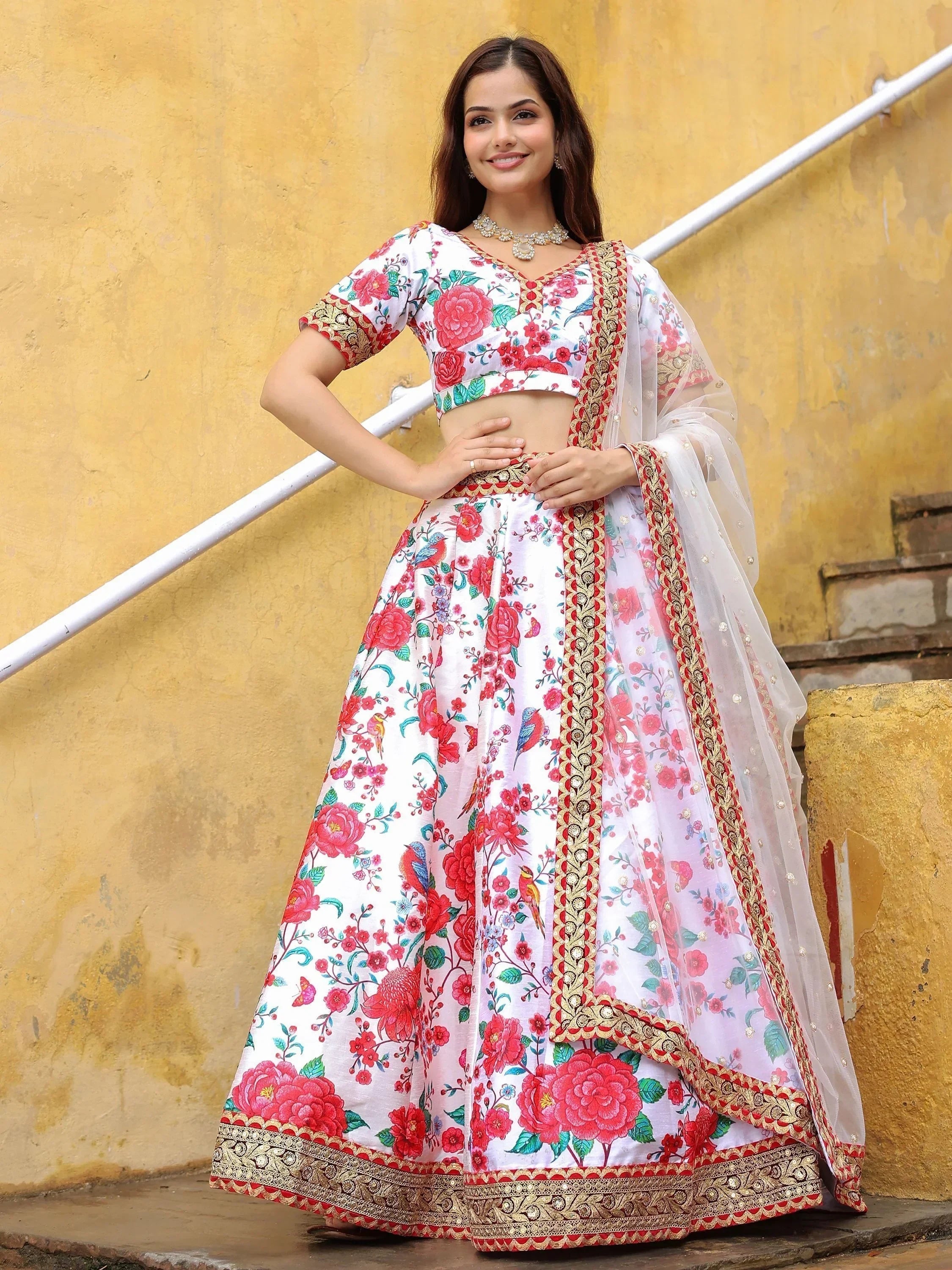 White floral lehenga choli with red rose print and gold embroidery, perfect for Indian ethnic wear occasions