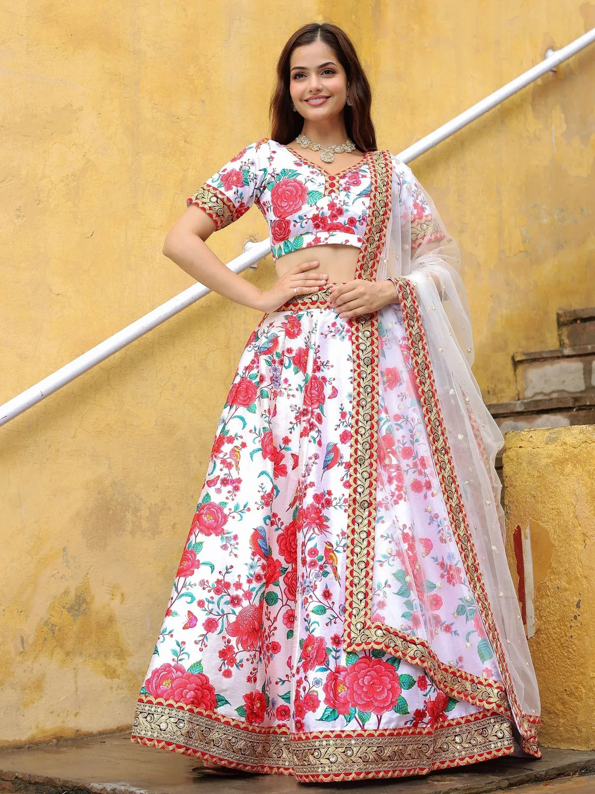 White floral lehenga choli with red rose print and gold embroidery, perfect for Indian ethnic wear occasions