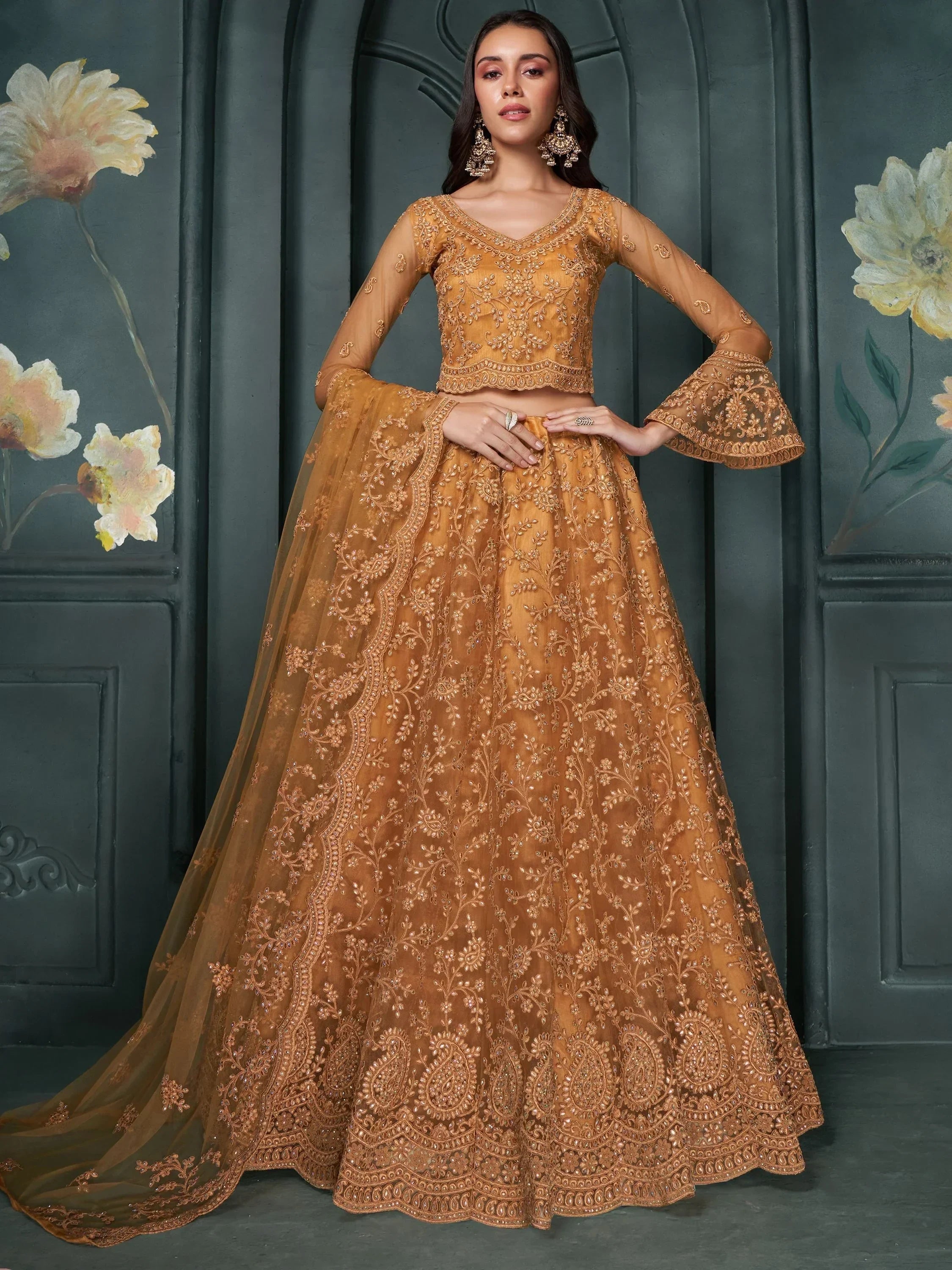 Mustard designer lehenga choli with heavy embroidery and bell sleeves, perfect for weddings and festivals