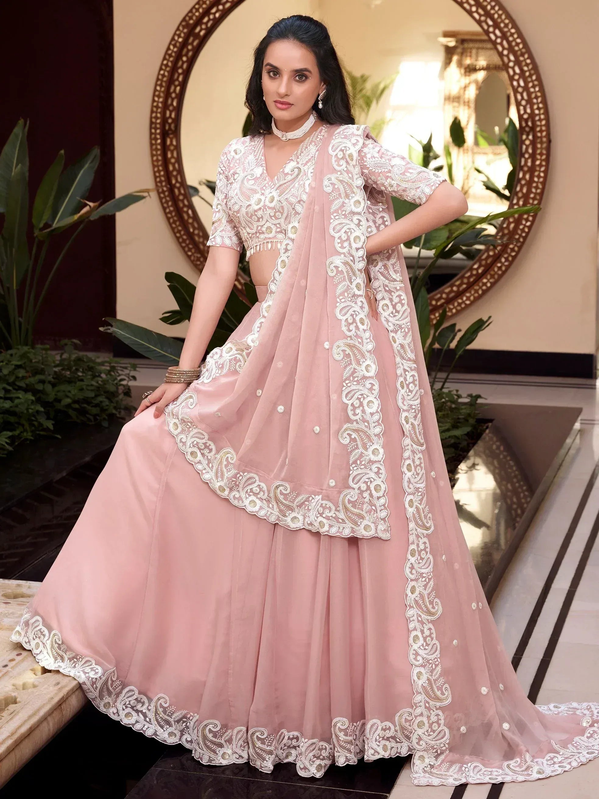 Pink embroidered lehenga choli with lace detailing, perfect for Indian ethnic wear occasions