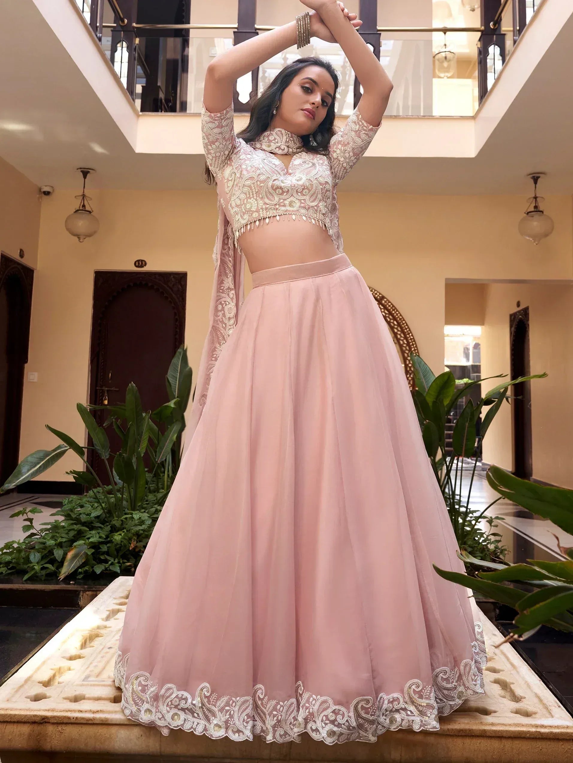Pink embroidered lehenga choli with lace top and flared skirt, perfect for Indian ethnic occasions