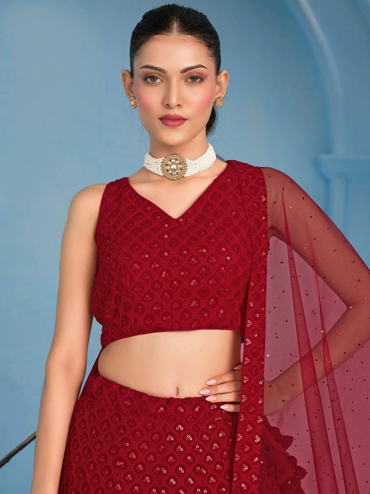 Red embroidered lehenga choli with sheer dupatta, perfect for Indian ethnic wear occasions