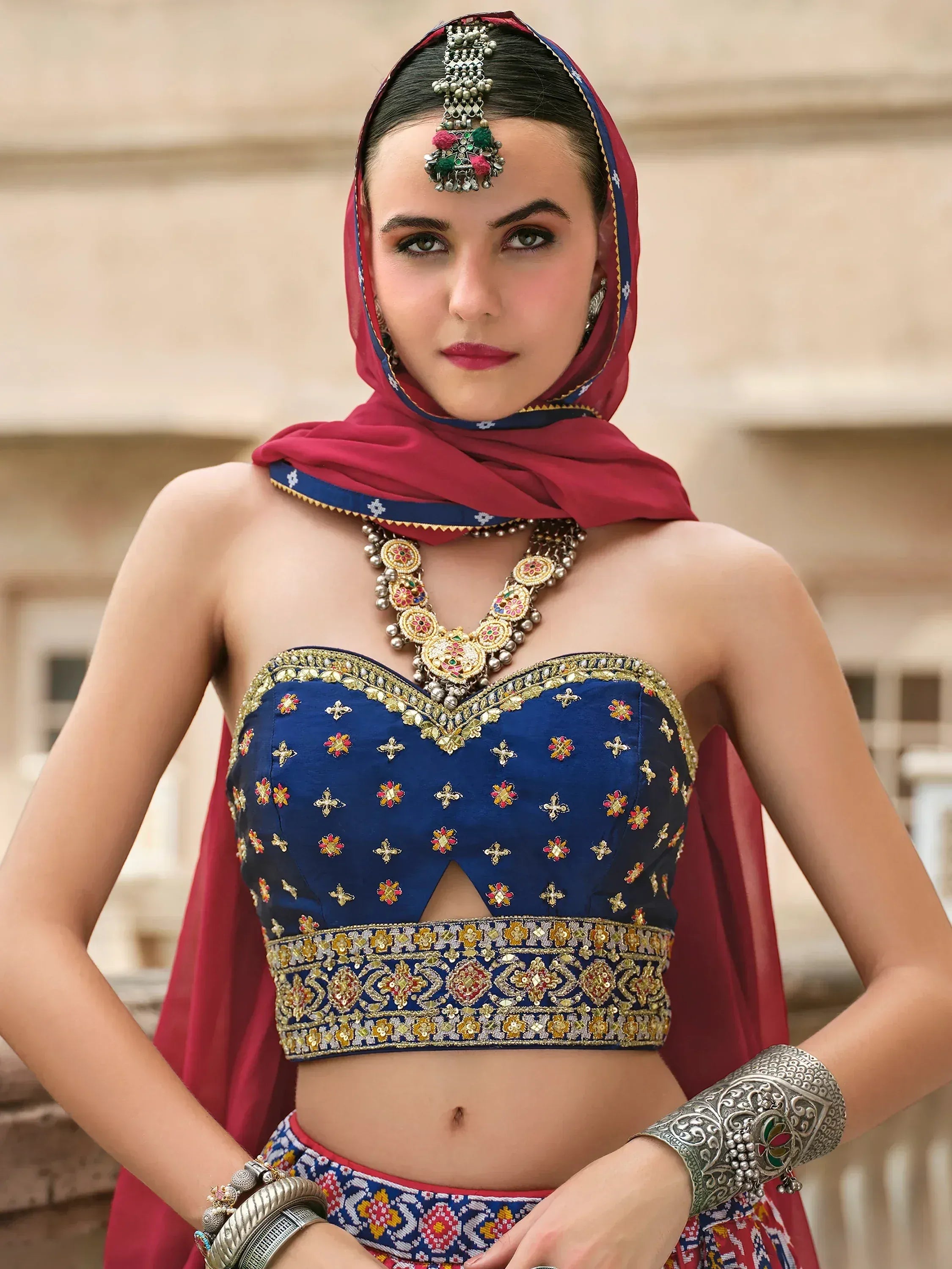 Blue embroidered lehenga choli with red dupatta, traditional Indian ethnic wear for women