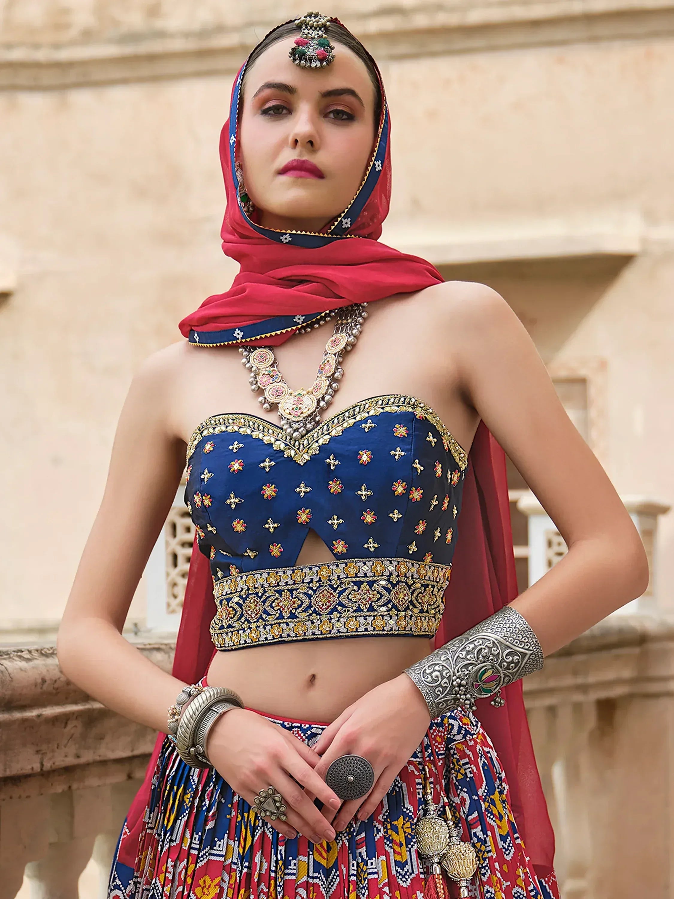 Blue embroidered lehenga choli with red dupatta, traditional Indian ethnic wear for women