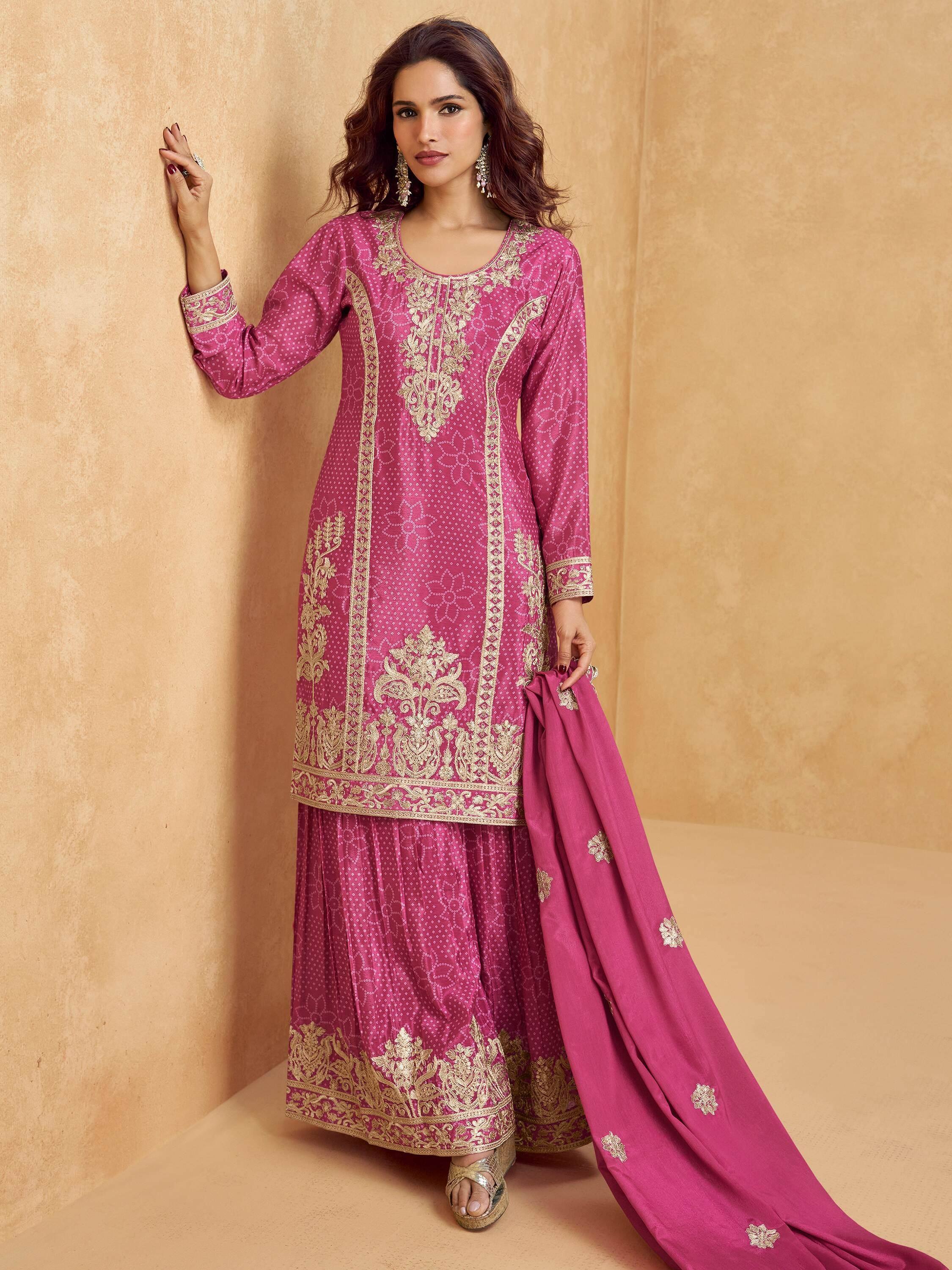 Pink embroidered salwar kameez with gold detailing, perfect for festive occasions and traditional events.