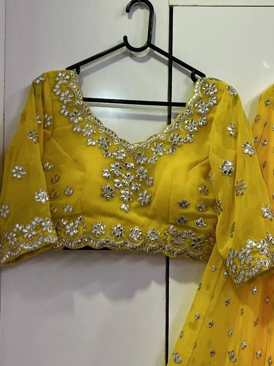 Yellow designer lehenga choli with floral silver embroidery, perfect for Indian ethnic wear occasions
