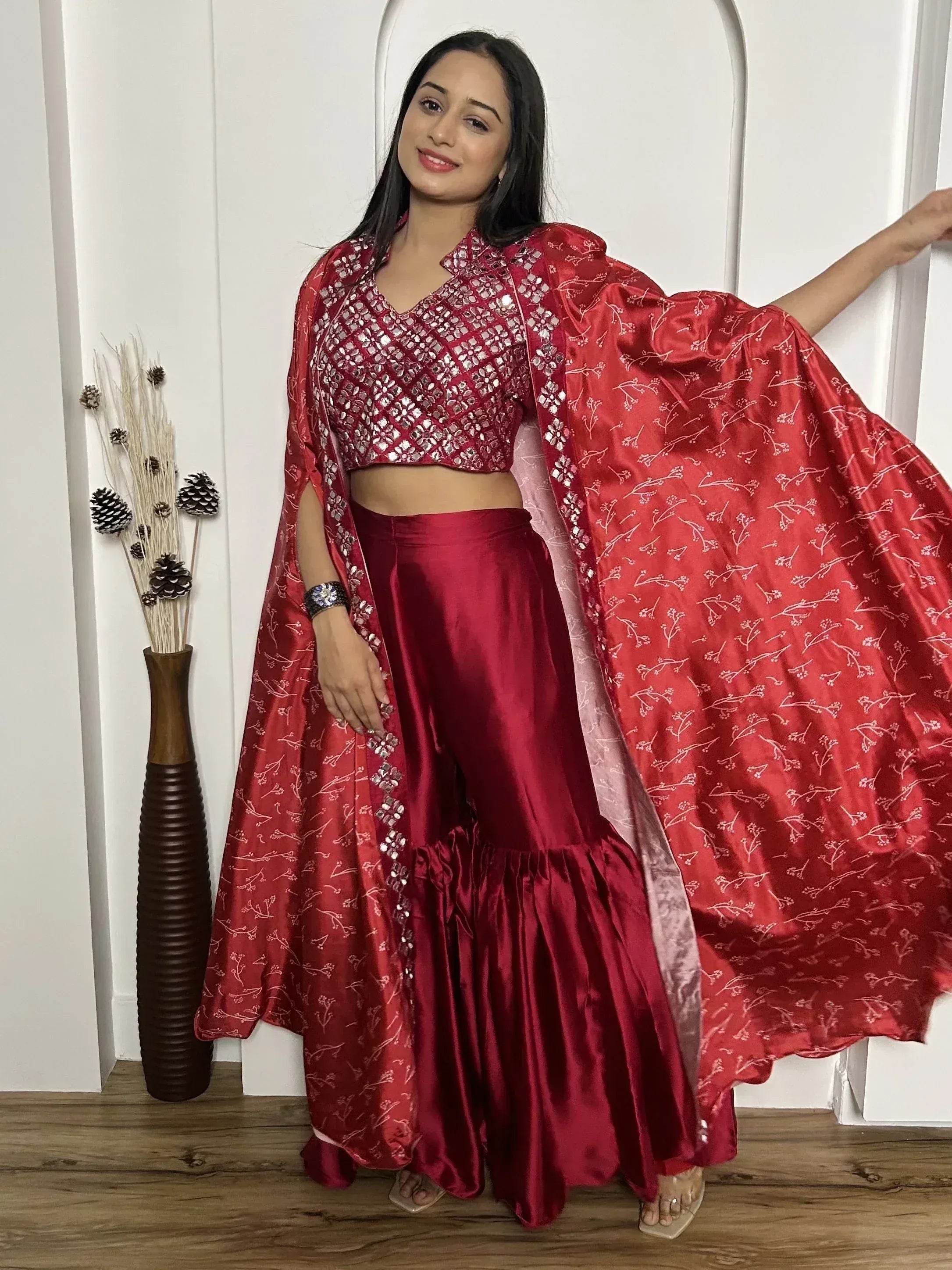 Red ethnic lehenga choli with mirror work and floral dupatta, perfect for Indian weddings and festive occasions
