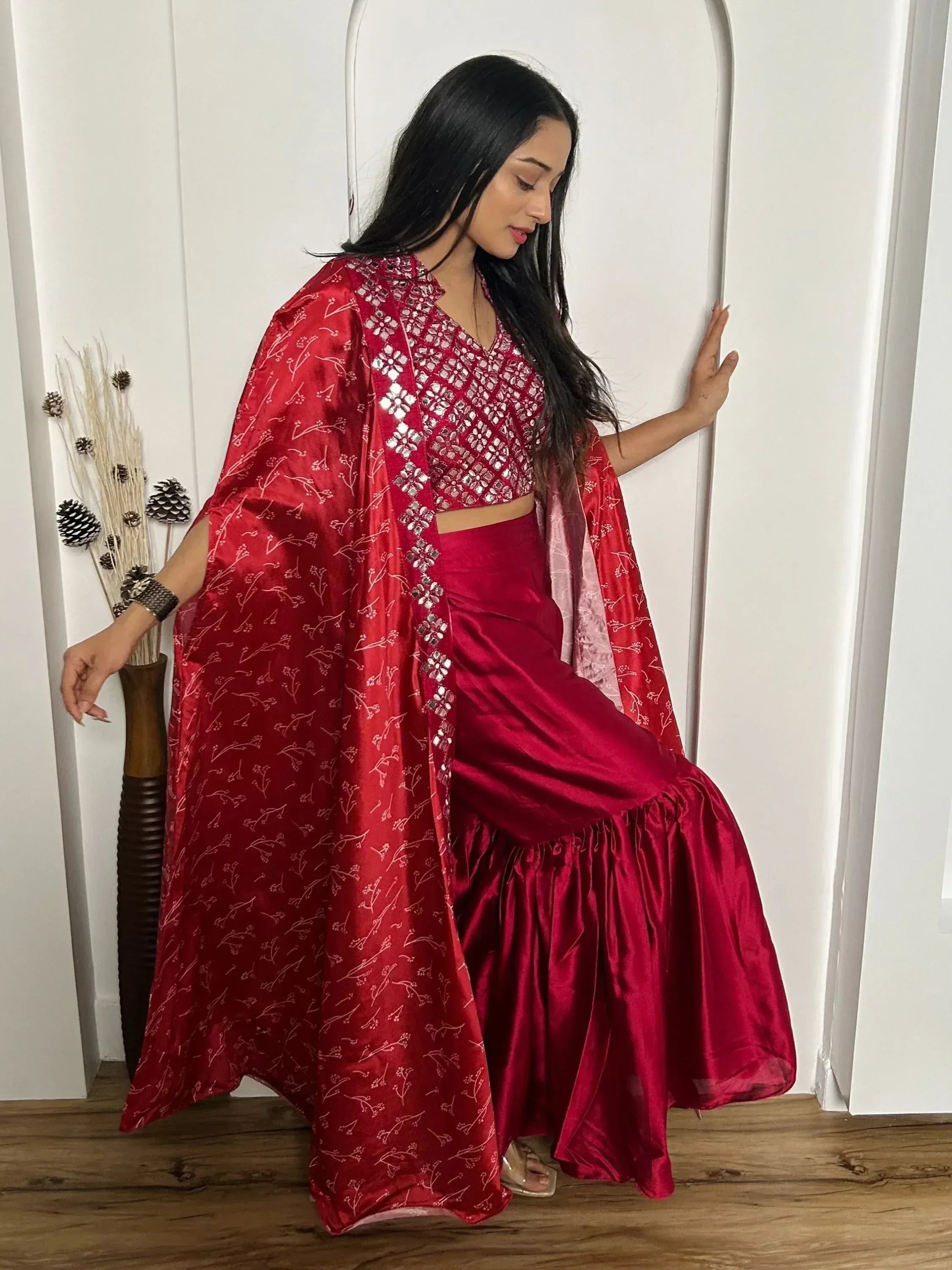 Red ethnic lehenga choli with floral cape, perfect for Indian weddings and festive occasions