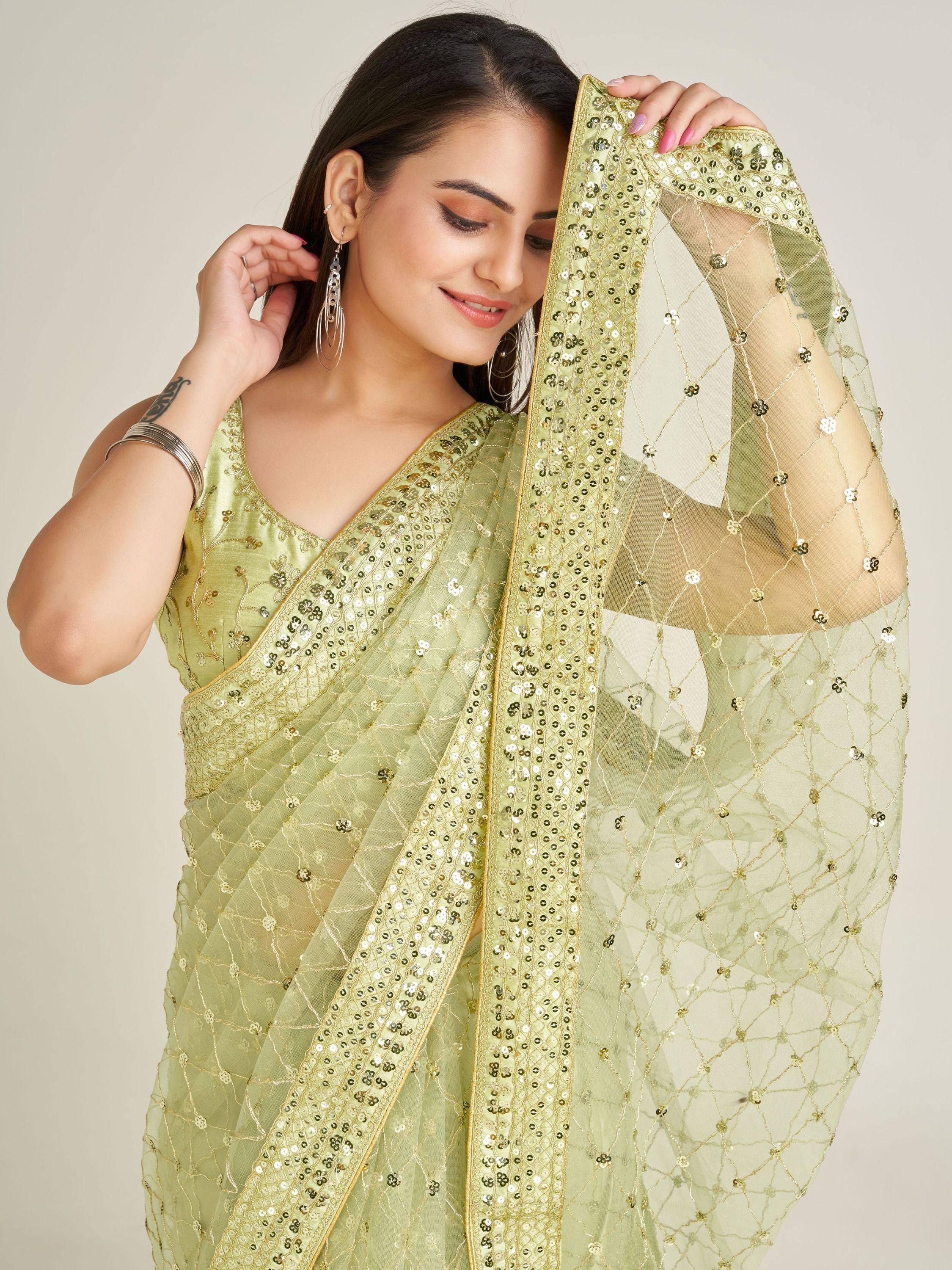 Light green sequin saree with gold embroidery, perfect for Indian ethnic wear and festive occasions.