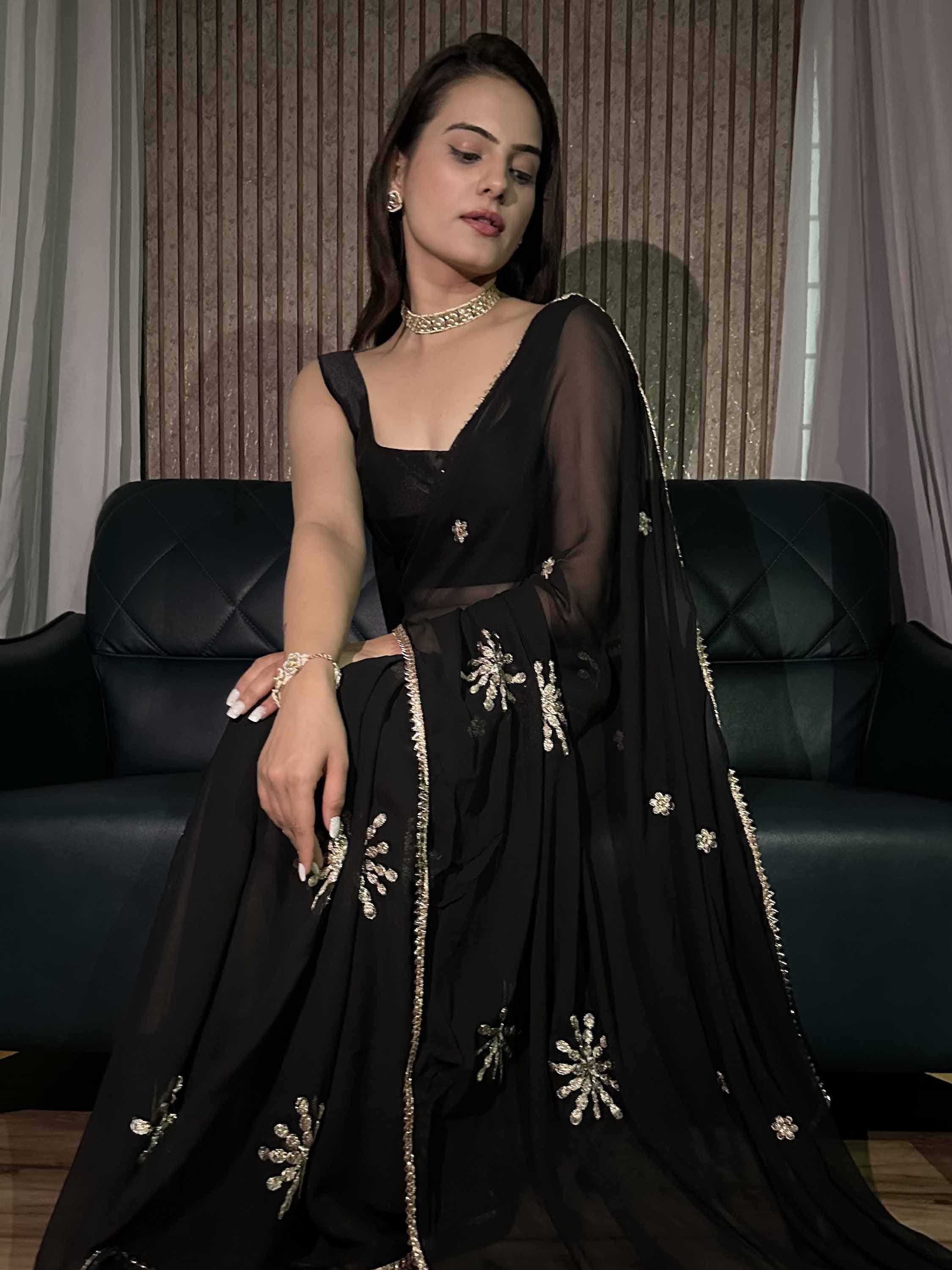 Black designer lehenga choli with gold floral embroidery, sheer dupatta, perfect for Indian ethnic occasions.