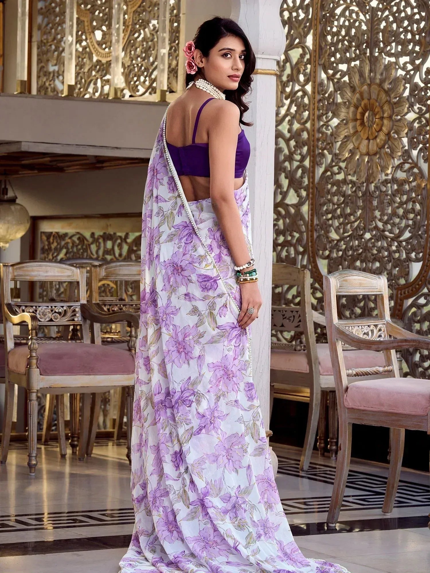 Woman in purple floral saree with backless blouse, elegant ethnic wear for special occasions