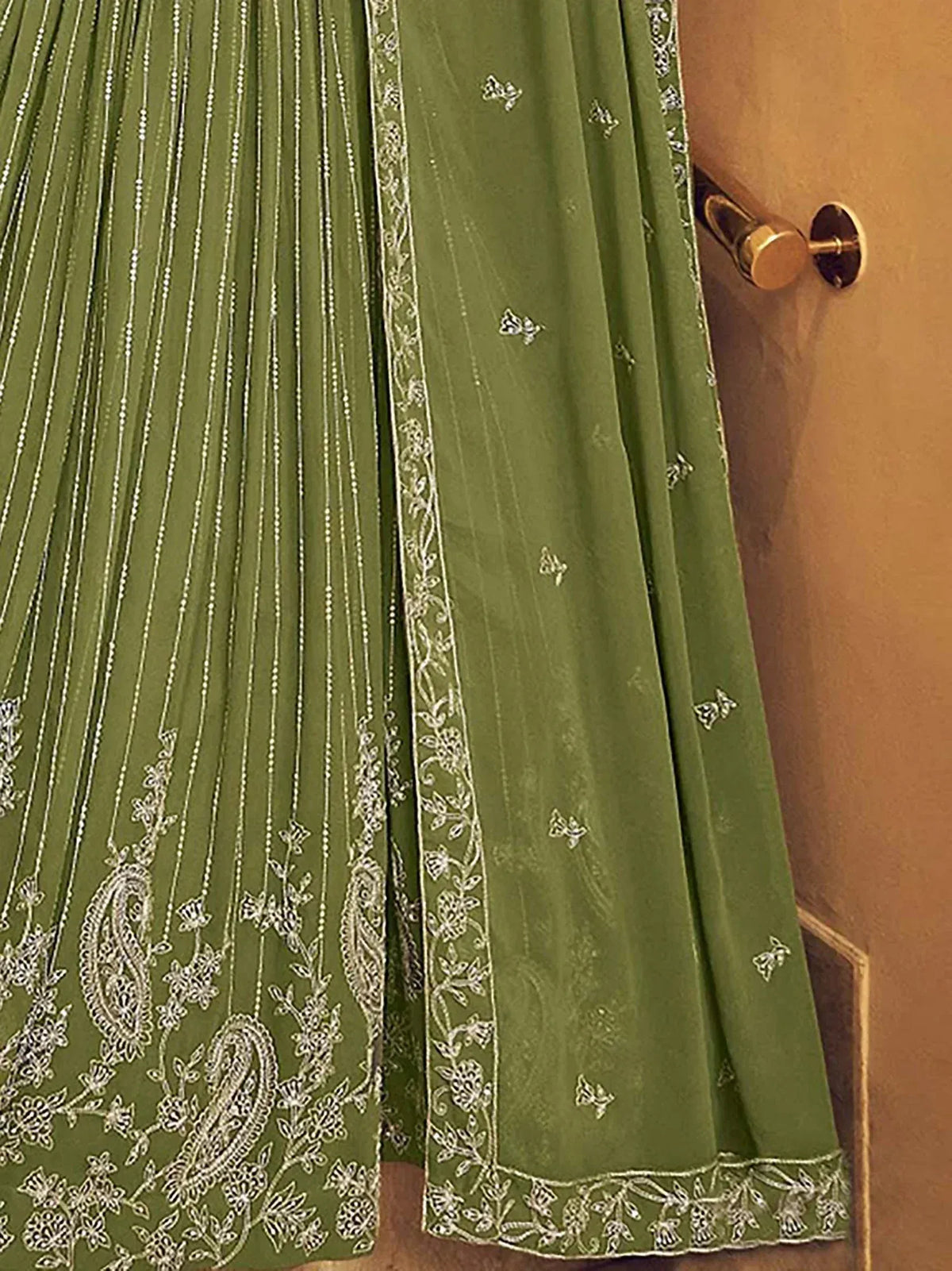 Olive green lehenga with silver paisley and floral embroidery, perfect for Indian ethnic wear.