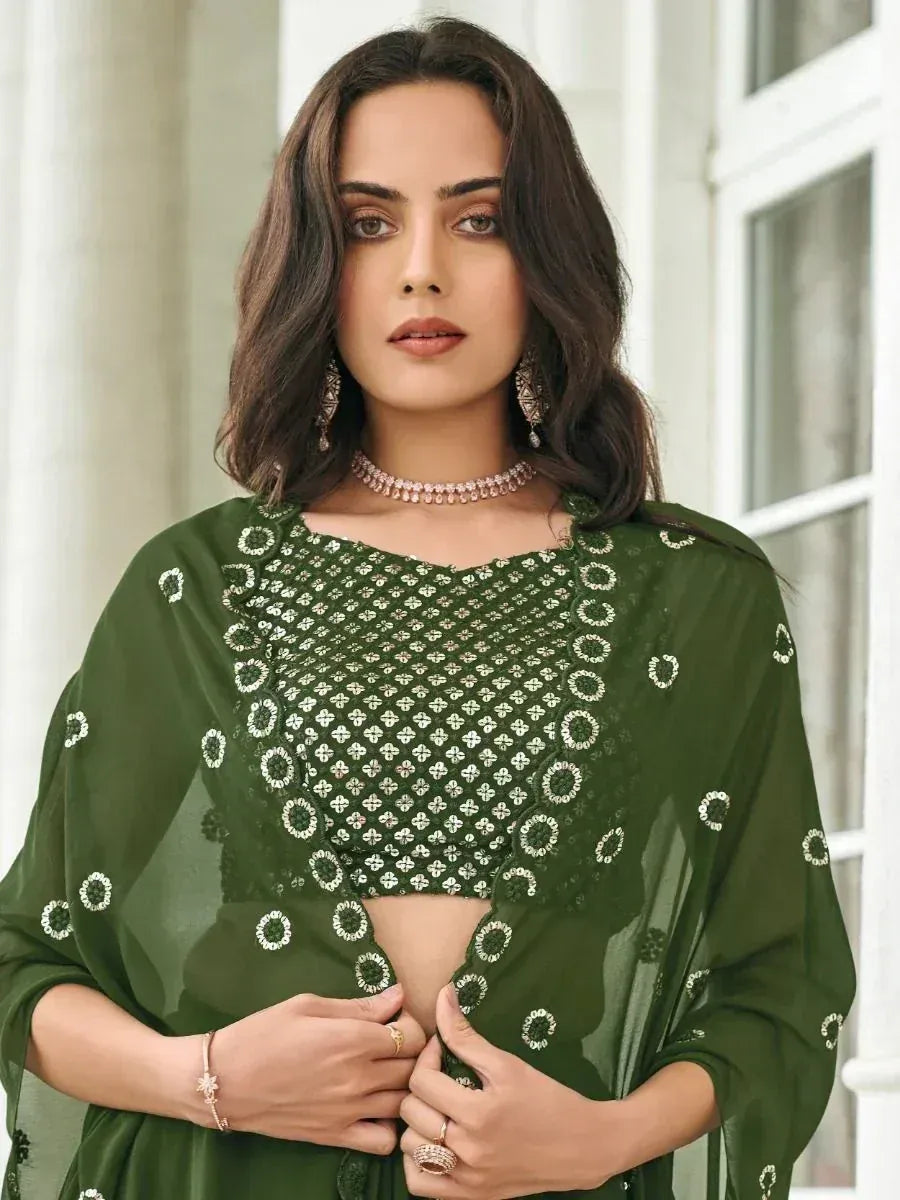Green embroidered ethnic crop top with sheer sleeves, perfect for Indian wear and festive occasions.
