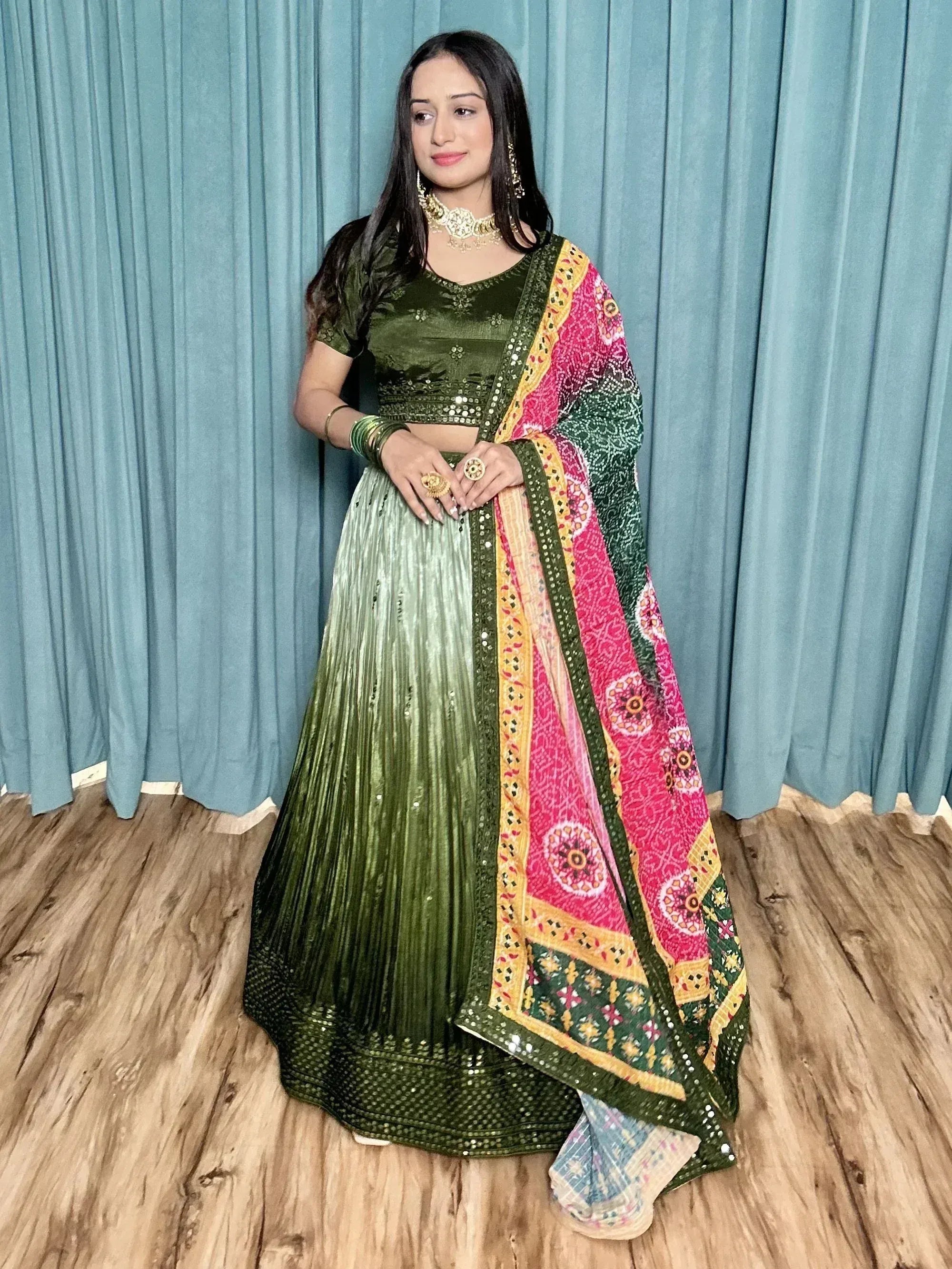 Green velvet lehenga choli with colorful printed dupatta, ethnic Indian wear for women