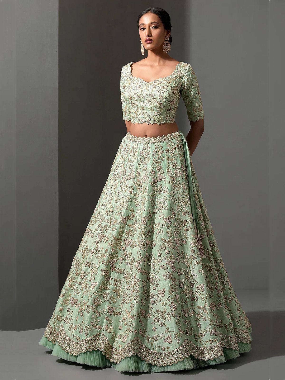 Mint green embroidered lehenga choli with floral detailing and scalloped hem for Indian ethnic wear