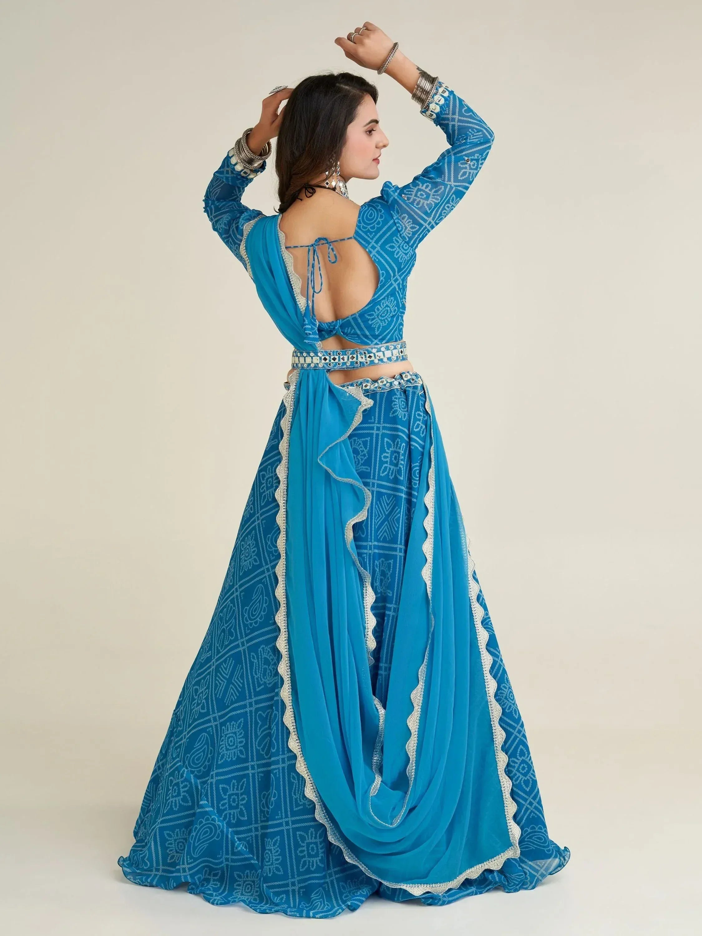 Blue printed lehenga choli with backless blouse and mirror work, ethnic Indian wear