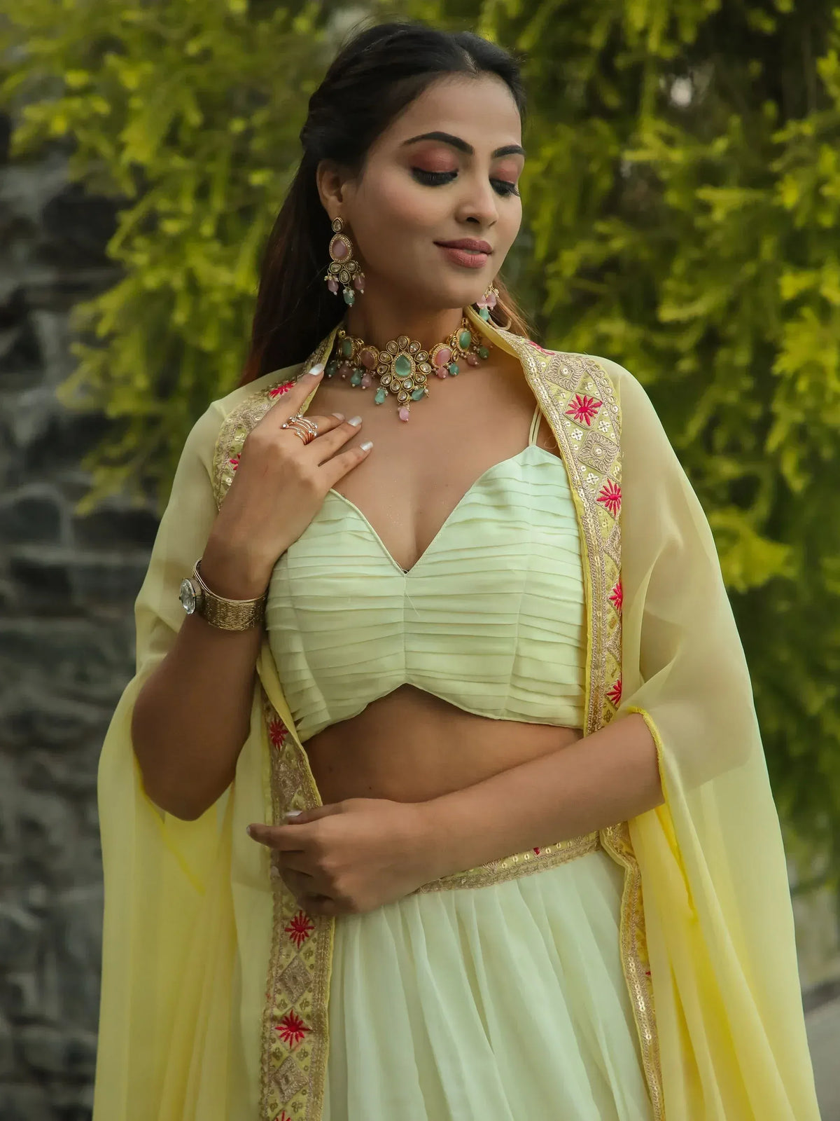 Elegant light green lehenga choli with embroidered yellow dupatta, perfect for Indian ethnic occasions.