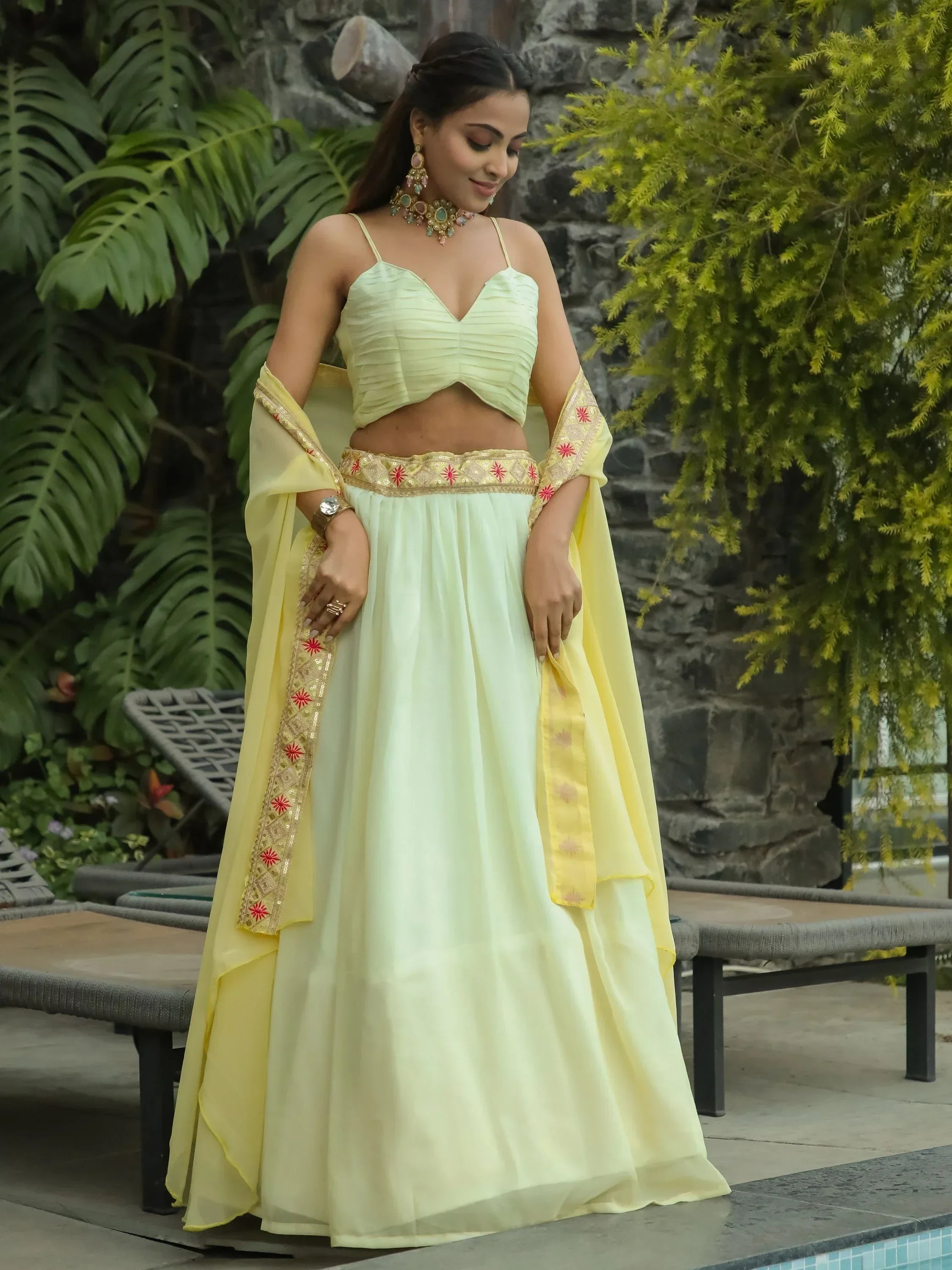Pastel yellow designer lehenga choli with embroidered dupatta, perfect for Indian ethnic wear occasions