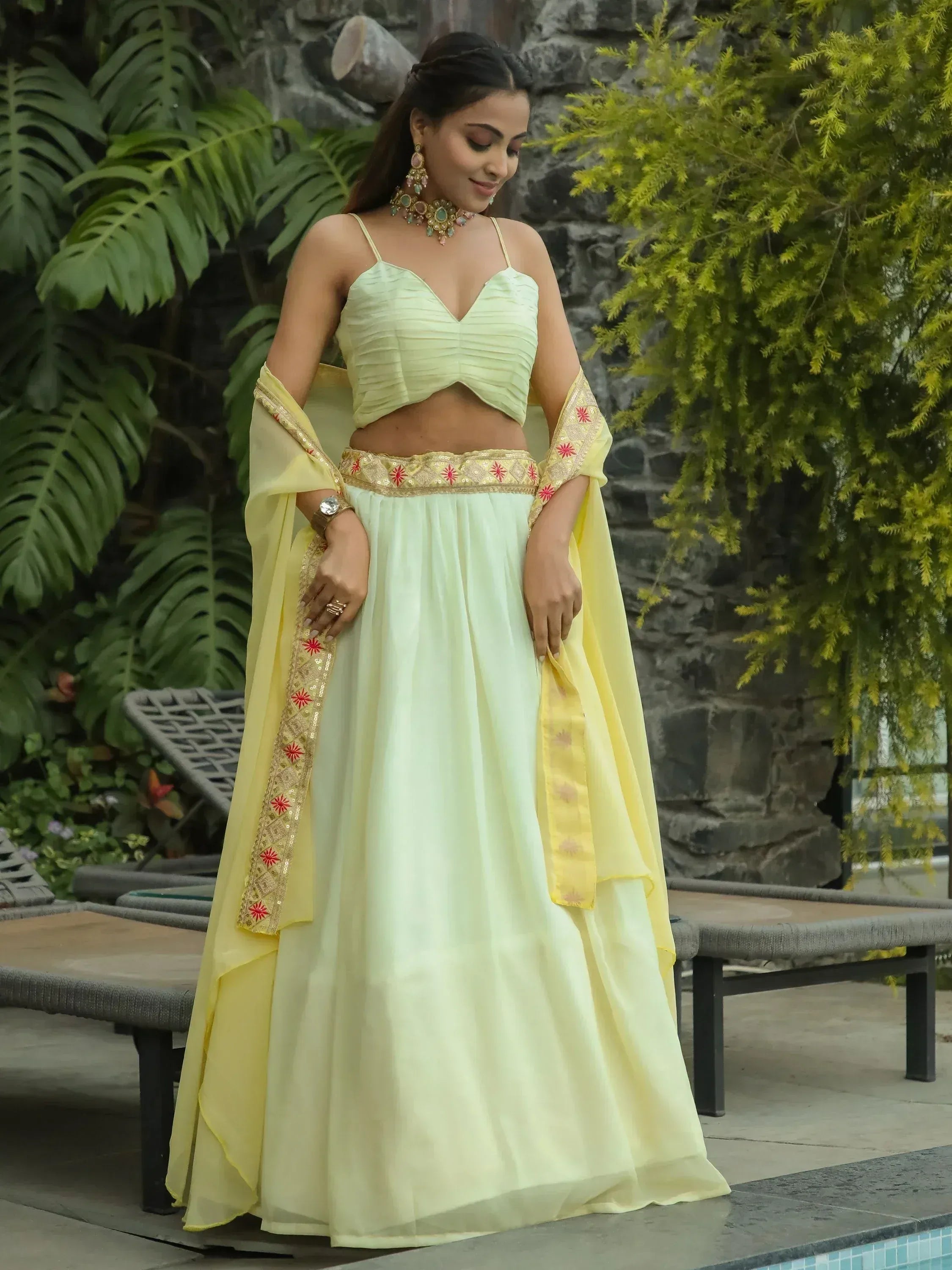 Pastel yellow designer lehenga choli with embroidered dupatta, perfect for Indian ethnic wear occasions