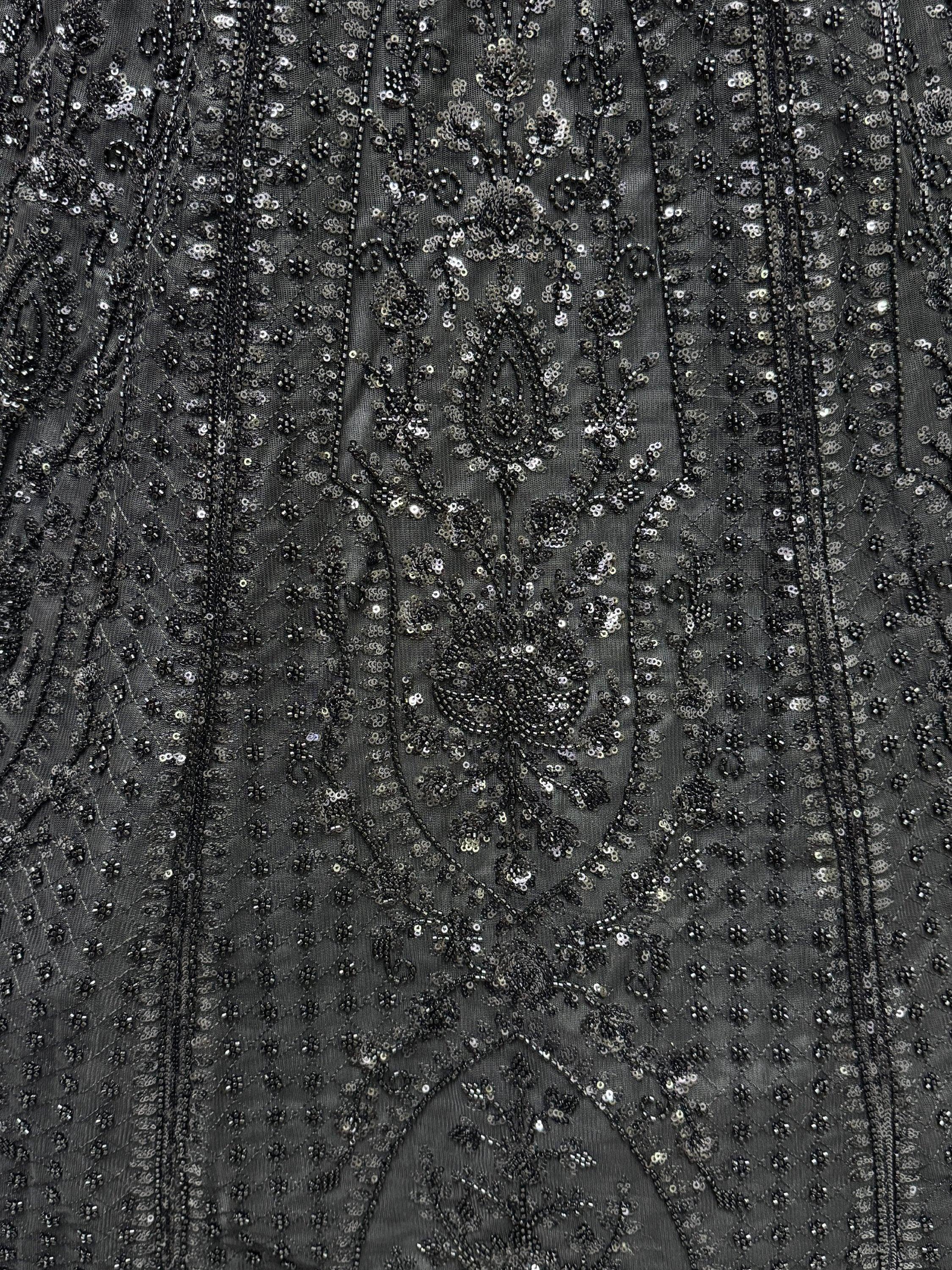 Black ethnic gown with intricate sequin and bead floral embroidery, perfect for festive occasions.
