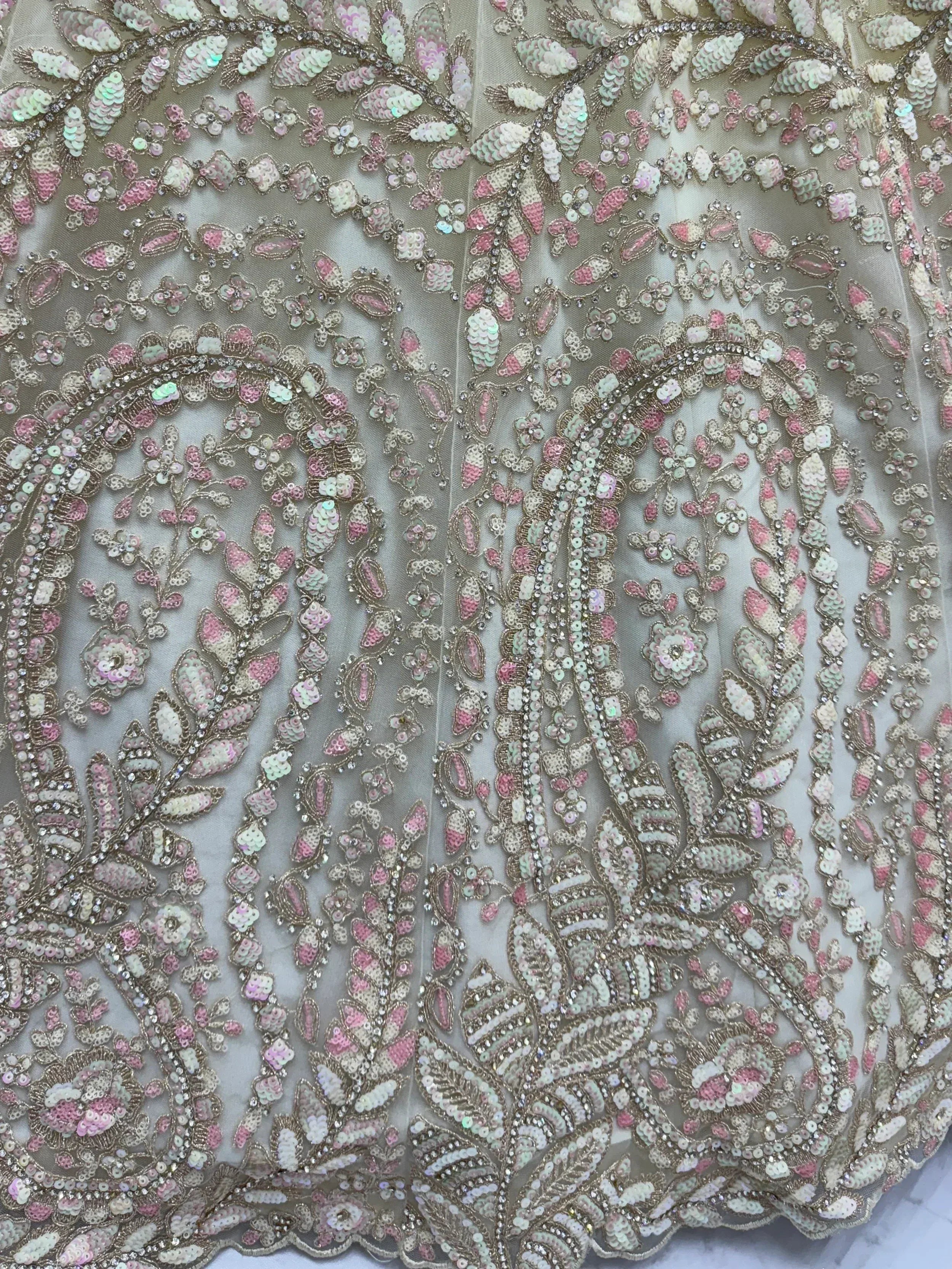 Elegant Indian ethnic wear with intricate floral sequin embroidery in pink and mint tones